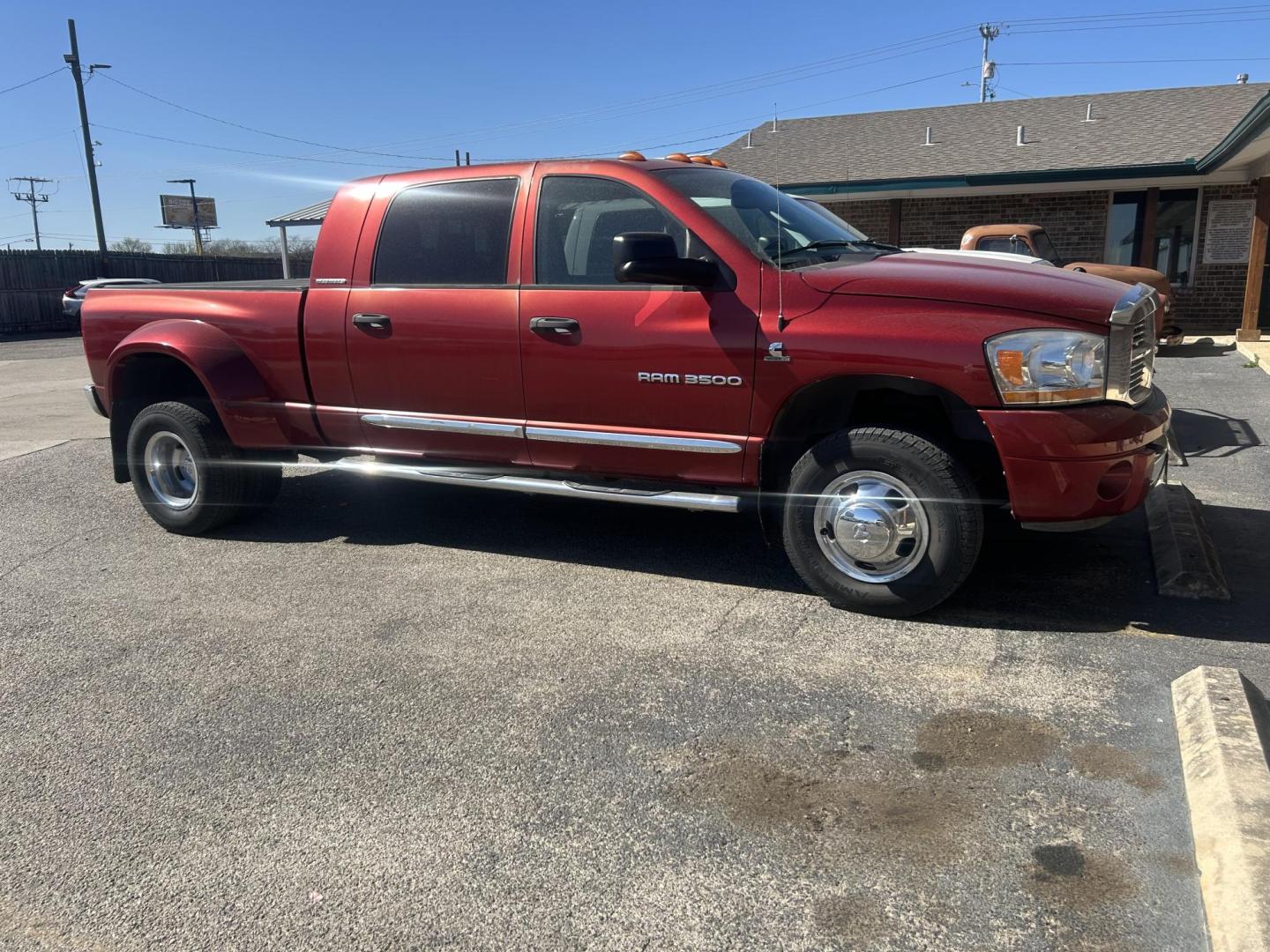 2006 Red Dodge Ram 3500 Laramie Mega Cab 4WD DRW (3D3MX49C66G) with an 5.9L L6 OHV 24V TURBO DIESEL engine, located at 1687 Business 35 S, New Braunfels, TX, 78130, (830) 625-7159, 29.655487, -98.051491 - Photo#3