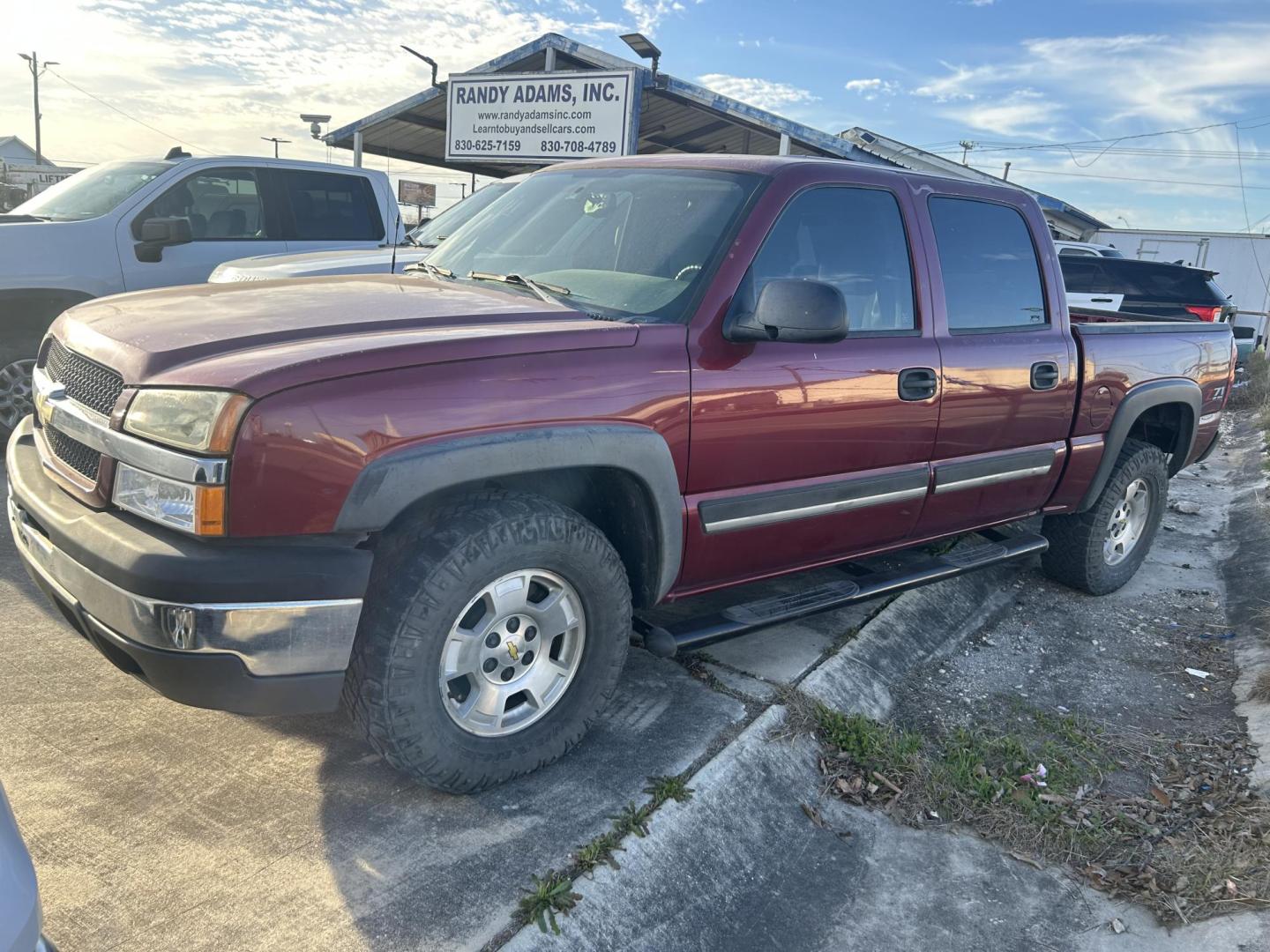 2005 Red Chevrolet Silverado 1500 LS Crew Cab 4WD (2GCEK13T851) with an 5.3L V8 OHV 16V engine, 4-Speed Automatic Overdrive transmission, located at 1687 Business 35 S, New Braunfels, TX, 78130, (830) 625-7159, 29.655487, -98.051491 - Photo#0