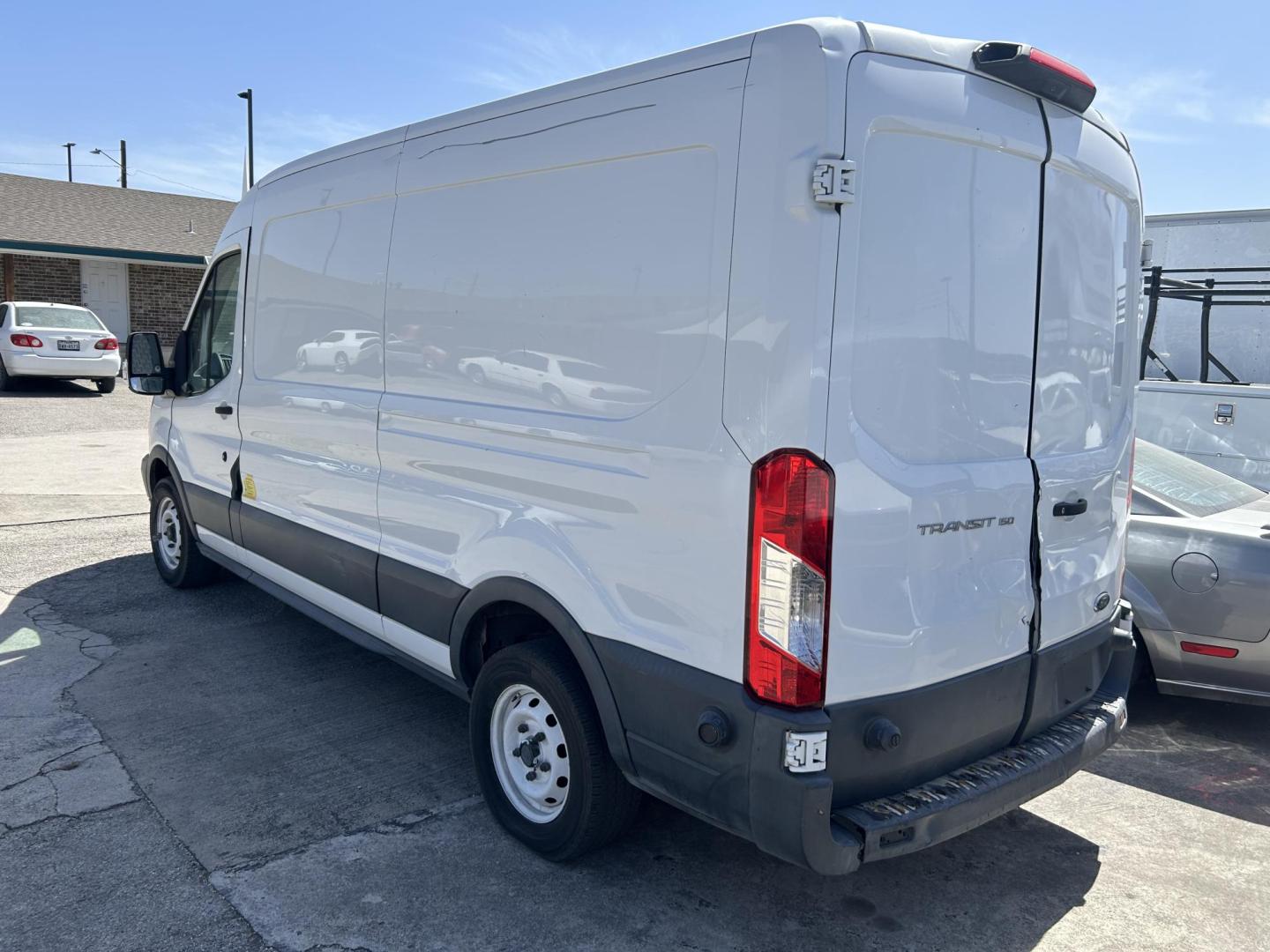 2018 White Ford Transit 150 Van Med. Roof w/Sliding Pass. 148-in. WB (1FTYE2CM4JK) with an 3.7L V6 DOHC 24V engine, 6A transmission, located at 1687 Business 35 S, New Braunfels, TX, 78130, (830) 625-7159, 29.655487, -98.051491 - Photo#1