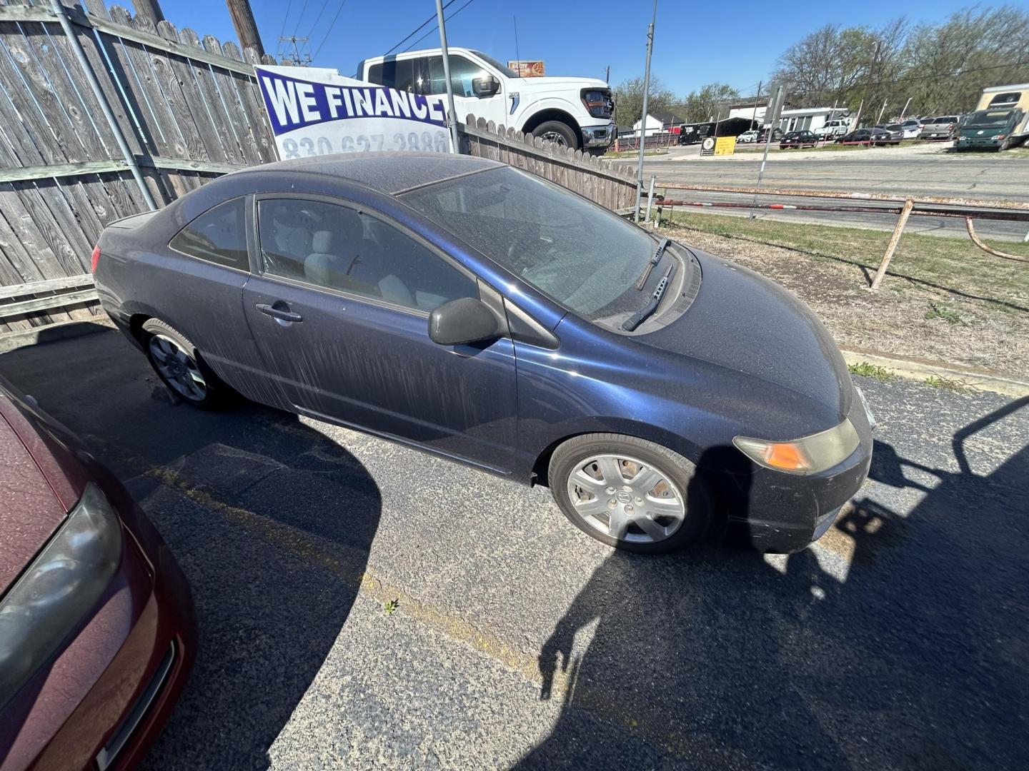 2009 Blue Honda Civic LX Coupe 5-Speed AT (2HGFG12649H) with an 1.8L L4 SOHC 16V engine, 5-Speed Automatic transmission, located at 1687 Business 35 S, New Braunfels, TX, 78130, (830) 625-7159, 29.655487, -98.051491 - Photo#1