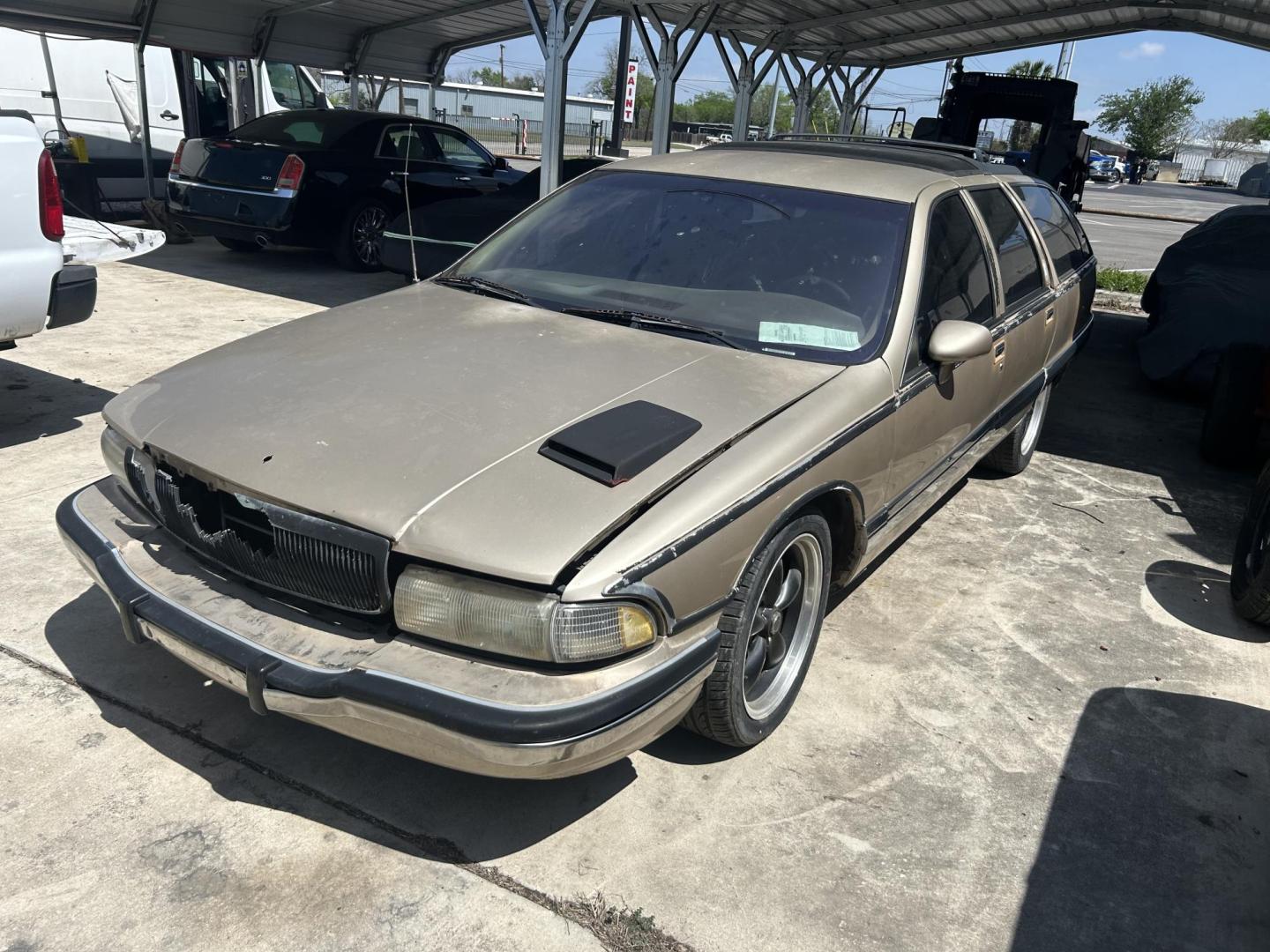 1994 Tan Buick Roadmaster Wagon Estate (1G4BR82P9RR) with an 5.7L V8 OHV 16V engine, 4-Speed Automatic Overdrive transmission, located at 1687 Business 35 S, New Braunfels, TX, 78130, (830) 625-7159, 29.655487, -98.051491 - Photo#0