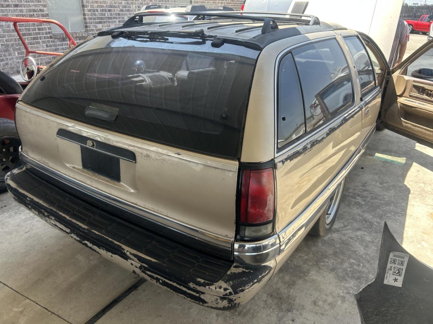 1994 Tan Buick Roadmaster Wagon Estate (1G4BR82P9RR) with an 5.7L V8 OHV 16V engine, 4-Speed Automatic Overdrive transmission, located at 1687 Business 35 S, New Braunfels, TX, 78130, (830) 625-7159, 29.655487, -98.051491 - Photo#6