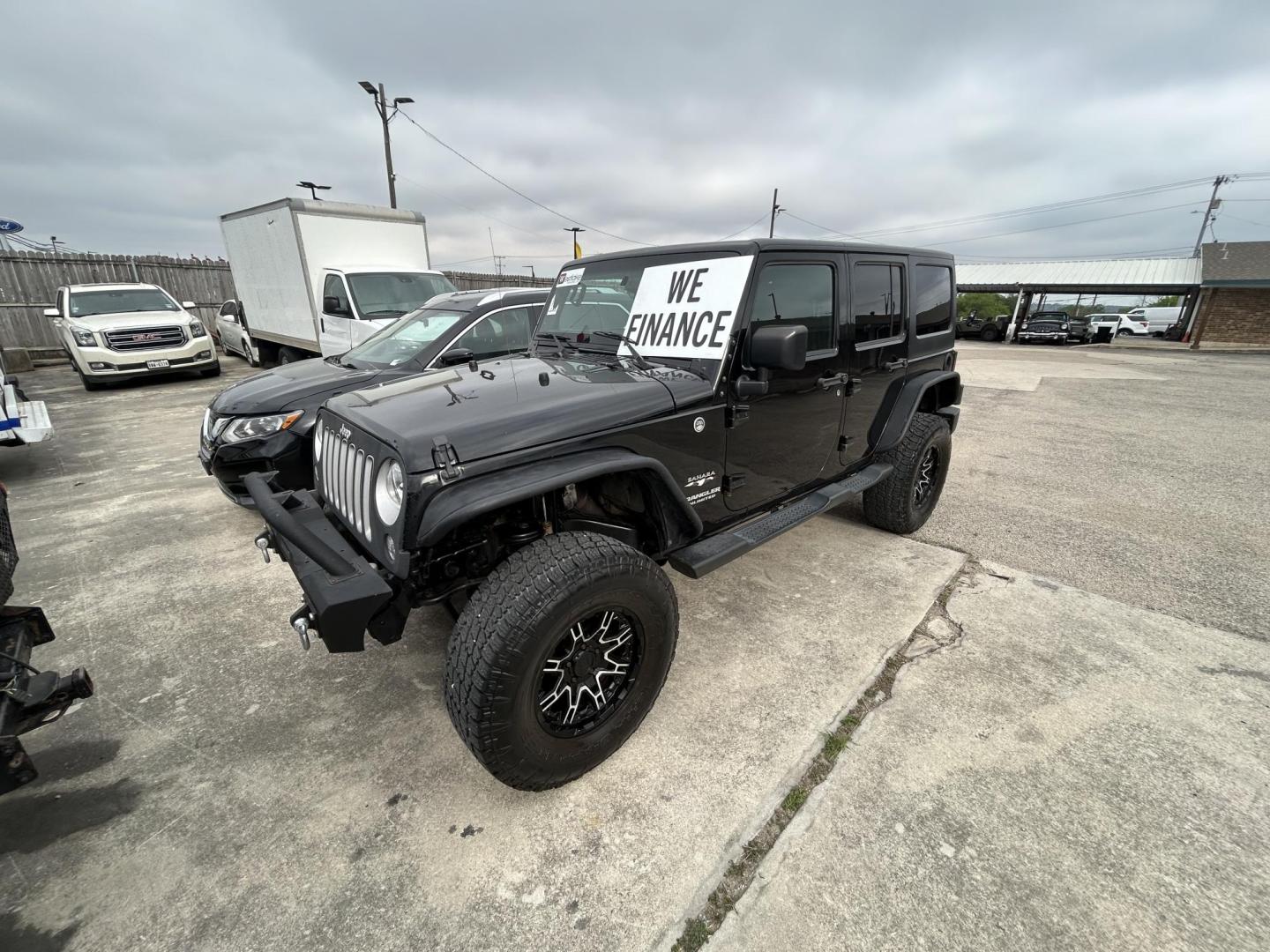 2016 Black Jeep Wrangler Unlimited Sahara 4WD (1C4HJWEG8GL) with an 3.6L V6 DOHC 24V FFV engine, located at 1687 Business 35 S, New Braunfels, TX, 78130, (830) 625-7159, 29.655487, -98.051491 - Photo#0