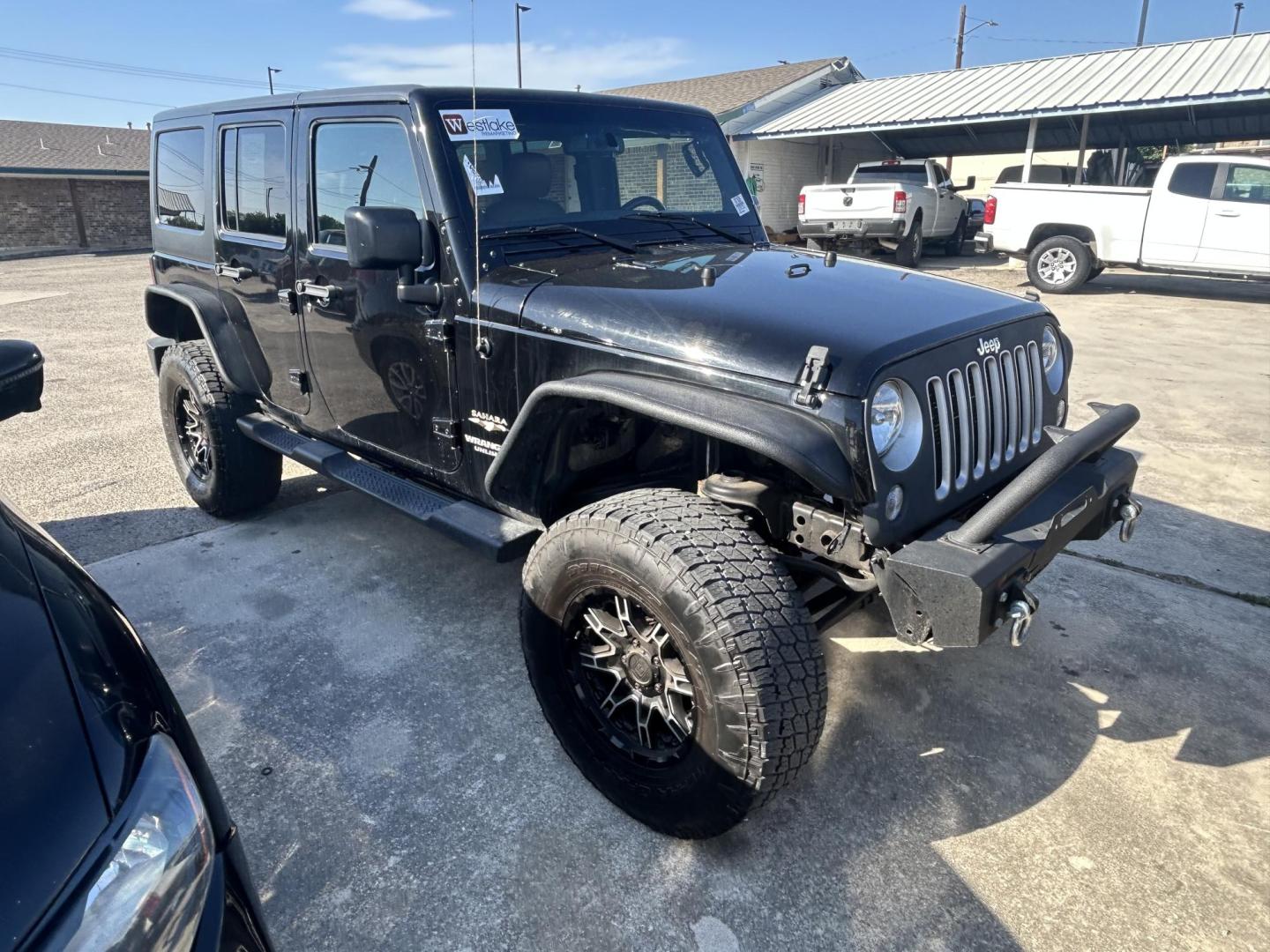 2016 Black Jeep Wrangler Unlimited Sahara 4WD (1C4HJWEG8GL) with an 3.6L V6 DOHC 24V FFV engine, located at 1687 Business 35 S, New Braunfels, TX, 78130, (830) 625-7159, 29.655487, -98.051491 - Photo#4