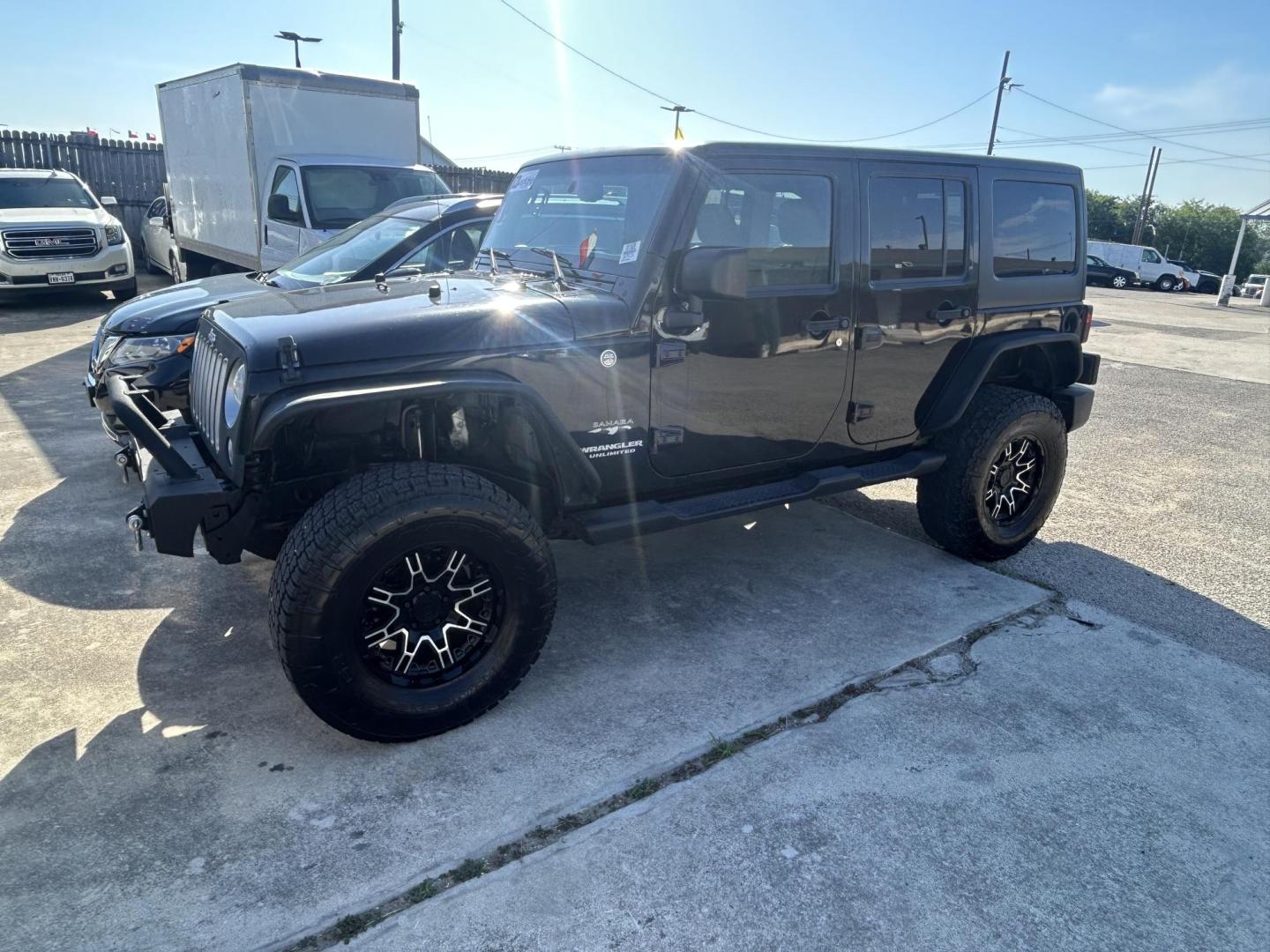 2016 Black Jeep Wrangler Unlimited Sahara 4WD (1C4HJWEG8GL) with an 3.6L V6 DOHC 24V FFV engine, located at 1687 Business 35 S, New Braunfels, TX, 78130, (830) 625-7159, 29.655487, -98.051491 - Photo#1
