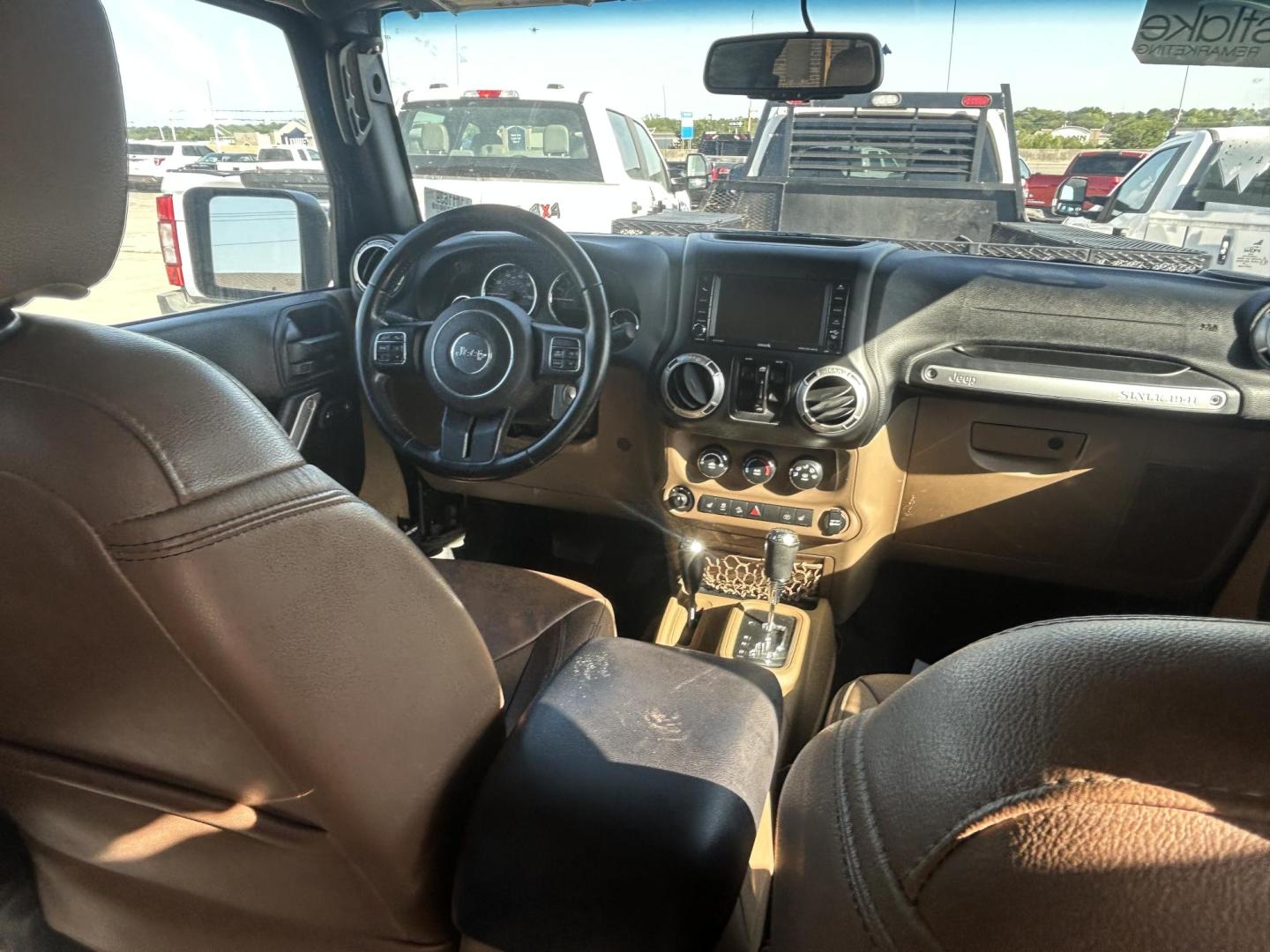 2016 Black Jeep Wrangler Unlimited Sahara 4WD (1C4HJWEG8GL) with an 3.6L V6 DOHC 24V FFV engine, located at 1687 Business 35 S, New Braunfels, TX, 78130, (830) 625-7159, 29.655487, -98.051491 - Photo#11