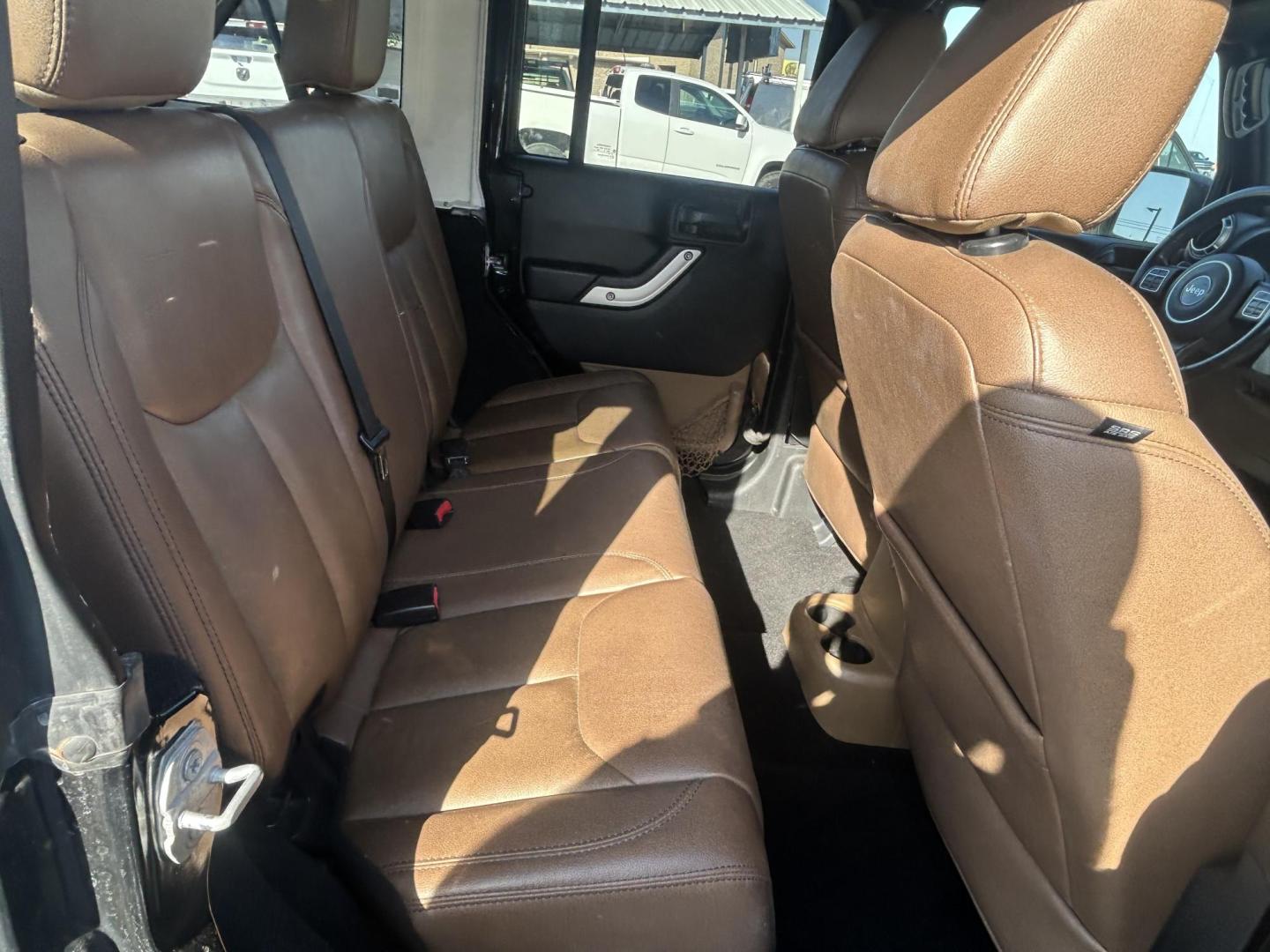 2016 Black Jeep Wrangler Unlimited Sahara 4WD (1C4HJWEG8GL) with an 3.6L V6 DOHC 24V FFV engine, located at 1687 Business 35 S, New Braunfels, TX, 78130, (830) 625-7159, 29.655487, -98.051491 - Photo#8