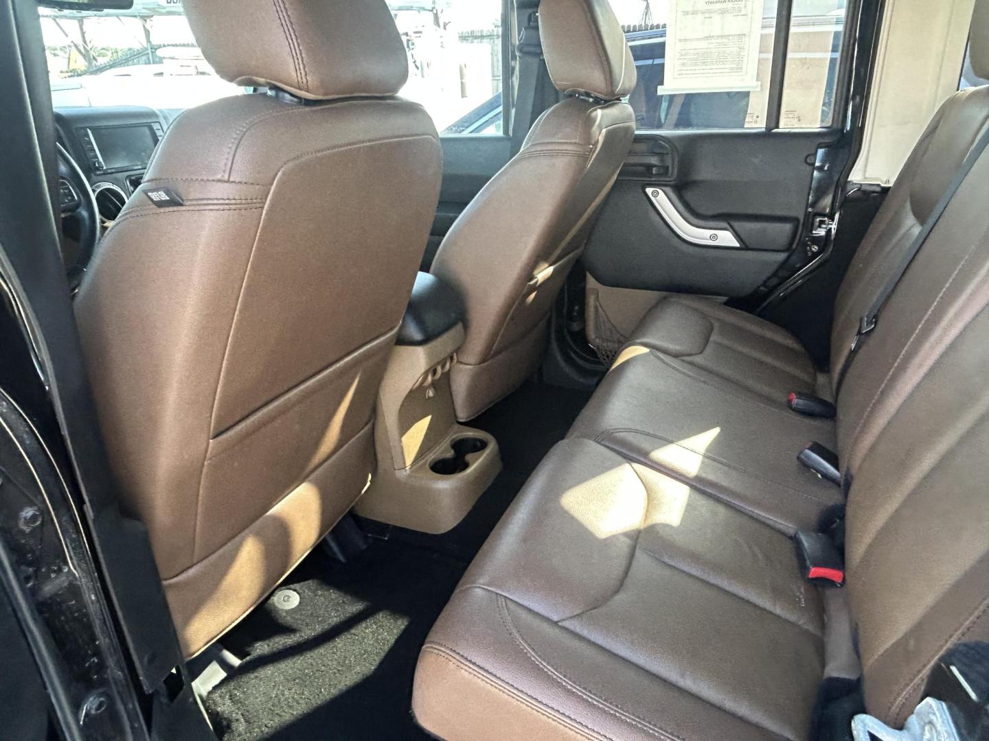 2016 Black Jeep Wrangler Unlimited Sahara 4WD (1C4HJWEG8GL) with an 3.6L V6 DOHC 24V FFV engine, located at 1687 Business 35 S, New Braunfels, TX, 78130, (830) 625-7159, 29.655487, -98.051491 - Photo#9