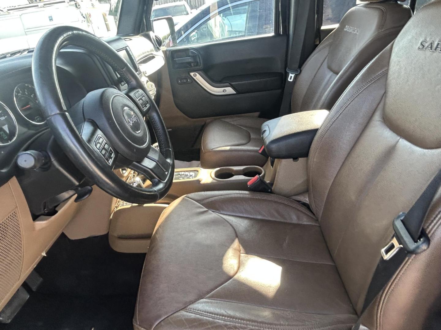 2016 Black Jeep Wrangler Unlimited Sahara 4WD (1C4HJWEG8GL) with an 3.6L V6 DOHC 24V FFV engine, located at 1687 Business 35 S, New Braunfels, TX, 78130, (830) 625-7159, 29.655487, -98.051491 - Photo#6