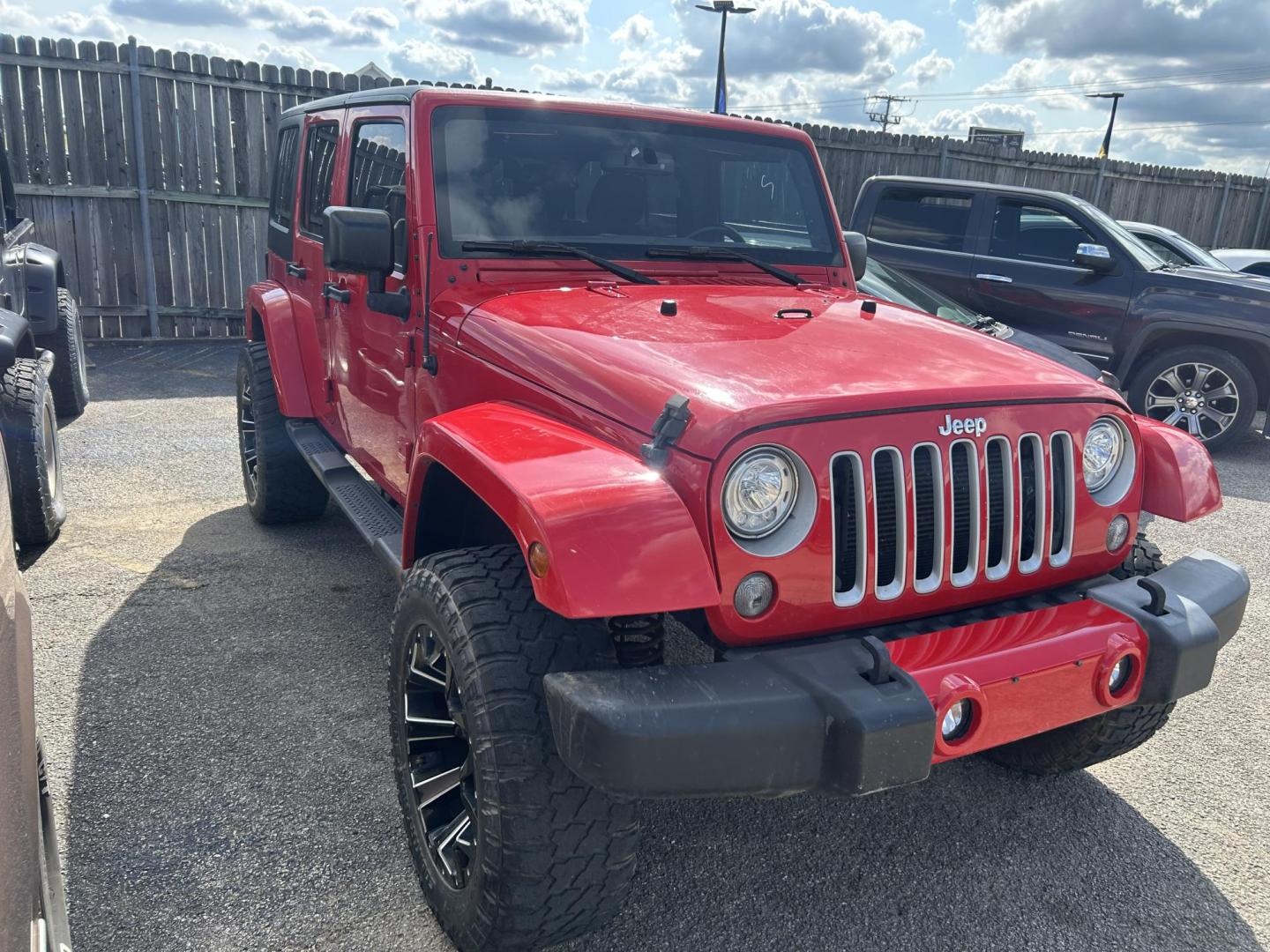 2017 Red Jeep Wrangler Unlimited Sahara 4WD (1C4HJWEGXHL) with an 3.6L V6 DOHC 24V FFV engine, located at 1687 Business 35 S, New Braunfels, TX, 78130, (830) 625-7159, 29.655487, -98.051491 - Photo#2