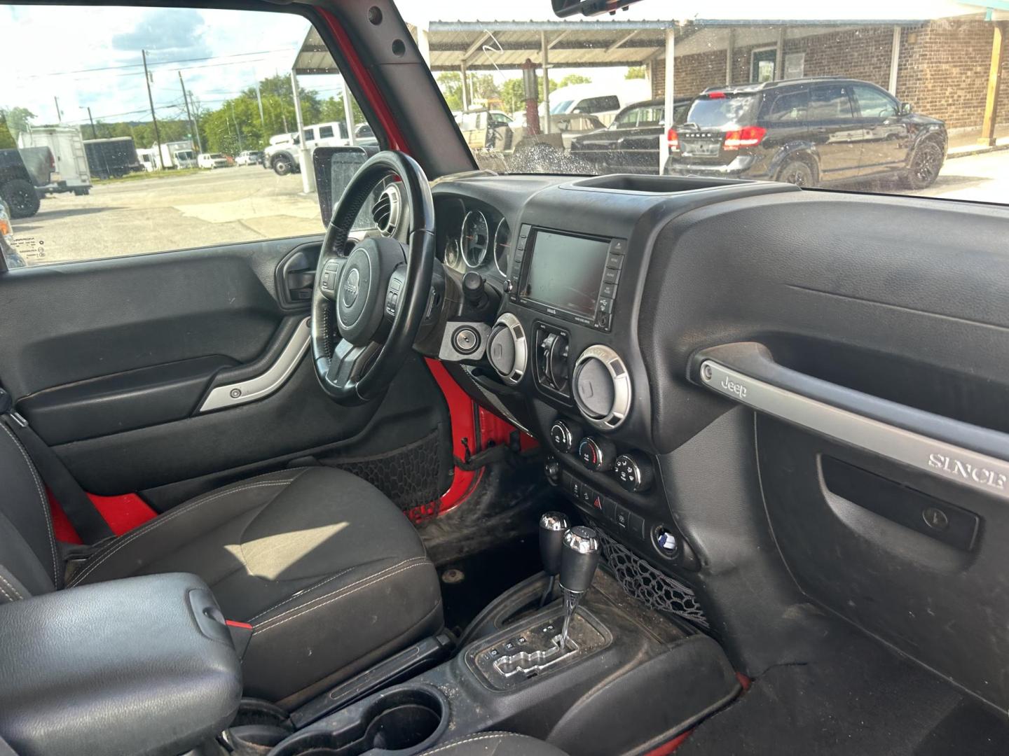 2017 Red Jeep Wrangler Unlimited Sahara 4WD (1C4HJWEGXHL) with an 3.6L V6 DOHC 24V FFV engine, located at 1687 Business 35 S, New Braunfels, TX, 78130, (830) 625-7159, 29.655487, -98.051491 - Photo#4