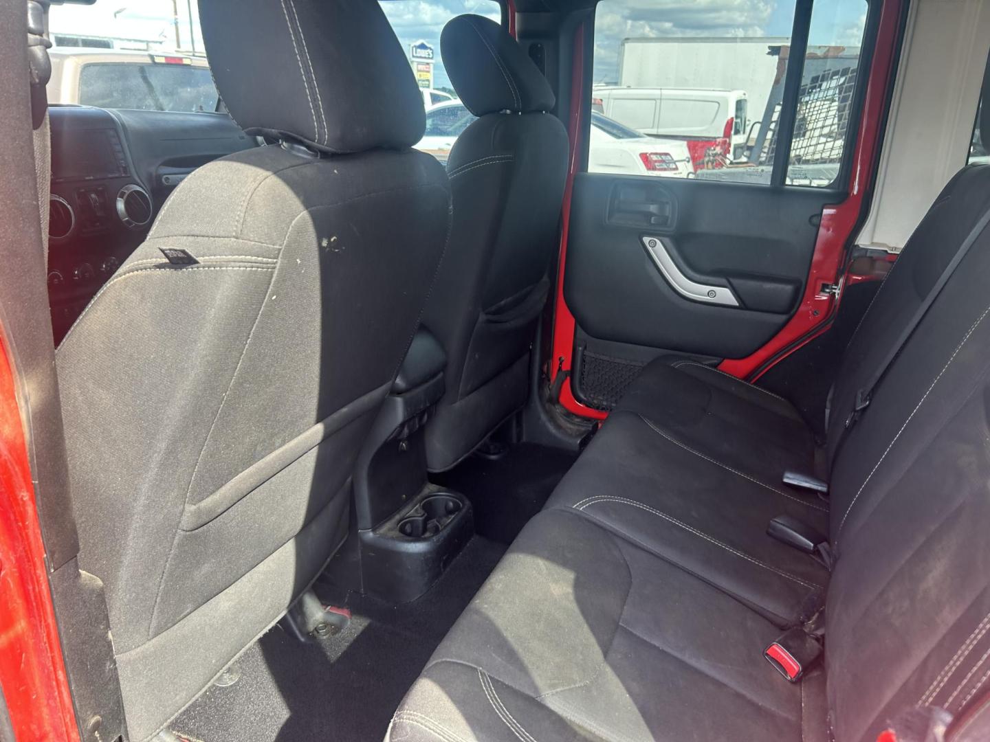 2017 Red Jeep Wrangler Unlimited Sahara 4WD (1C4HJWEGXHL) with an 3.6L V6 DOHC 24V FFV engine, located at 1687 Business 35 S, New Braunfels, TX, 78130, (830) 625-7159, 29.655487, -98.051491 - Photo#9