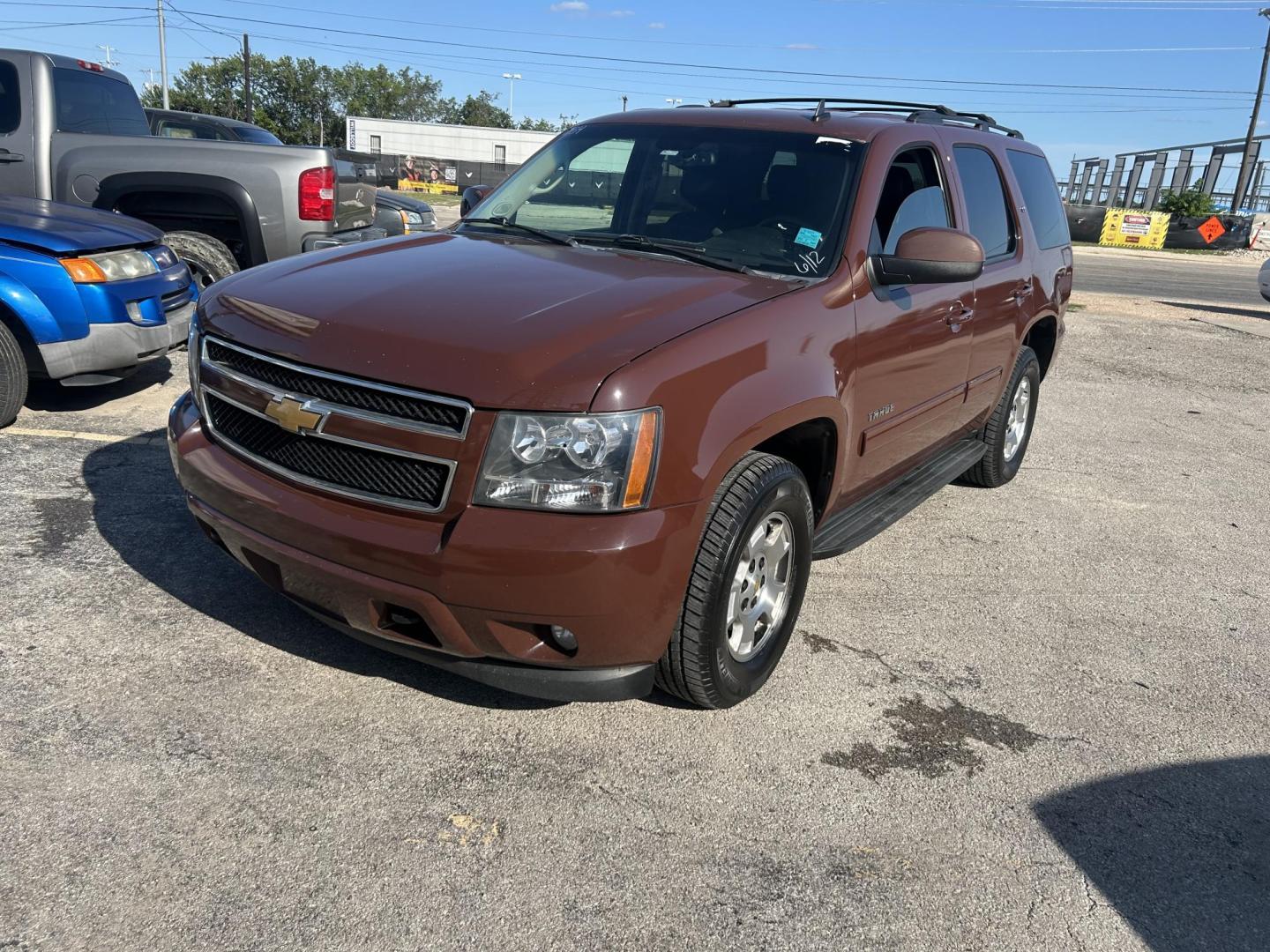 2013 Brown Chevrolet Tahoe LT 2WD (1GNSCBE07DR) with an 5.3L V8 OHV 16V FFV engine, 6-Speed Automatic transmission, located at 1687 Business 35 S, New Braunfels, TX, 78130, (830) 625-7159, 29.655487, -98.051491 - Photo#0