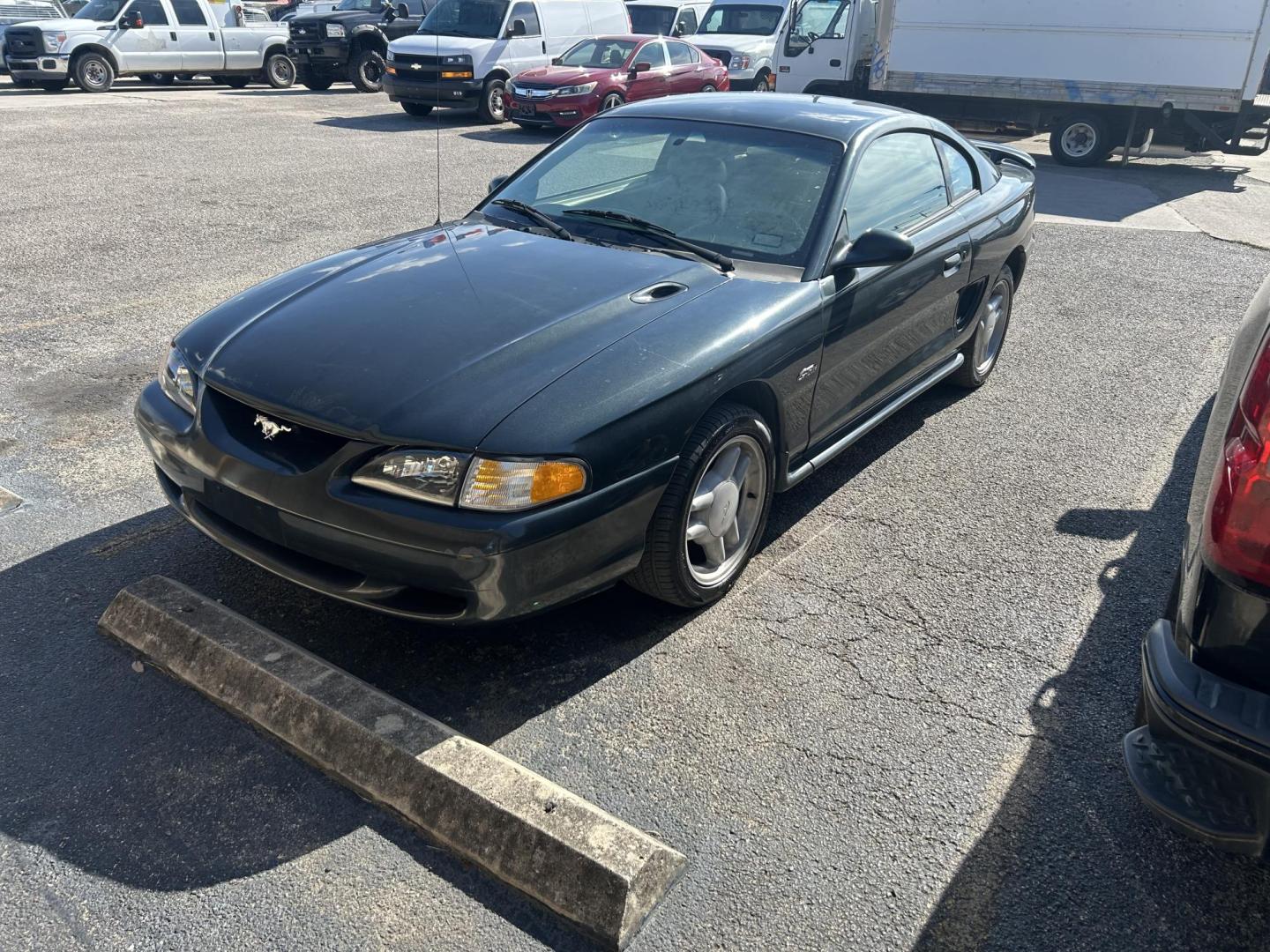 1998 Black Ford Mustang GT (1FAFP42X1WF) with an 4.6L V8 SOHC 16V engine, located at 1687 Business 35 S, New Braunfels, TX, 78130, (830) 625-7159, 29.655487, -98.051491 - Photo#0