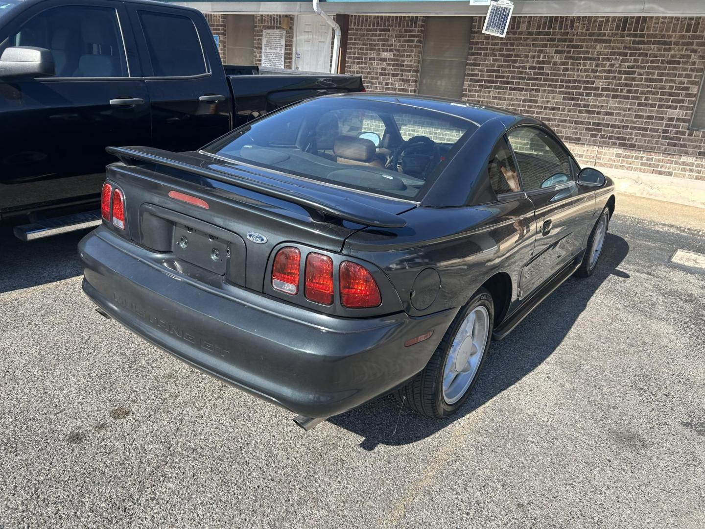 1998 Black Ford Mustang GT (1FAFP42X1WF) with an 4.6L V8 SOHC 16V engine, located at 1687 Business 35 S, New Braunfels, TX, 78130, (830) 625-7159, 29.655487, -98.051491 - Photo#2