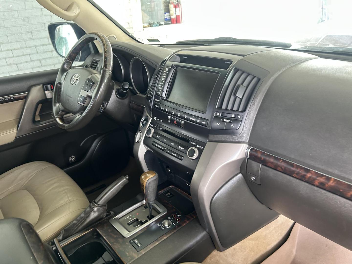 2010 Blue /Tan Toyota Land Cruiser 4WD (JTMHY7AJ0A5) with an 5.7L V8 DOHC 32V engine, 6-Speed Automatic transmission, located at 1687 Business 35 S, New Braunfels, TX, 78130, (830) 625-7159, 29.655487, -98.051491 - Photo#3