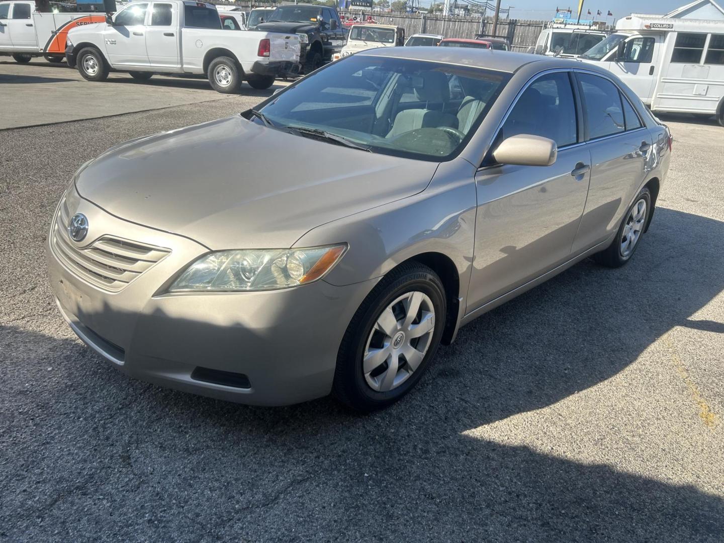 2007 Gold Toyota Camry CE 5-Spd AT (4T4BE46K07R) with an 2.4L L4 DOHC 16V engine, 5-Speed Automatic Overdrive transmission, located at 1687 Business 35 S, New Braunfels, TX, 78130, (830) 625-7159, 29.655487, -98.051491 - Photo#0