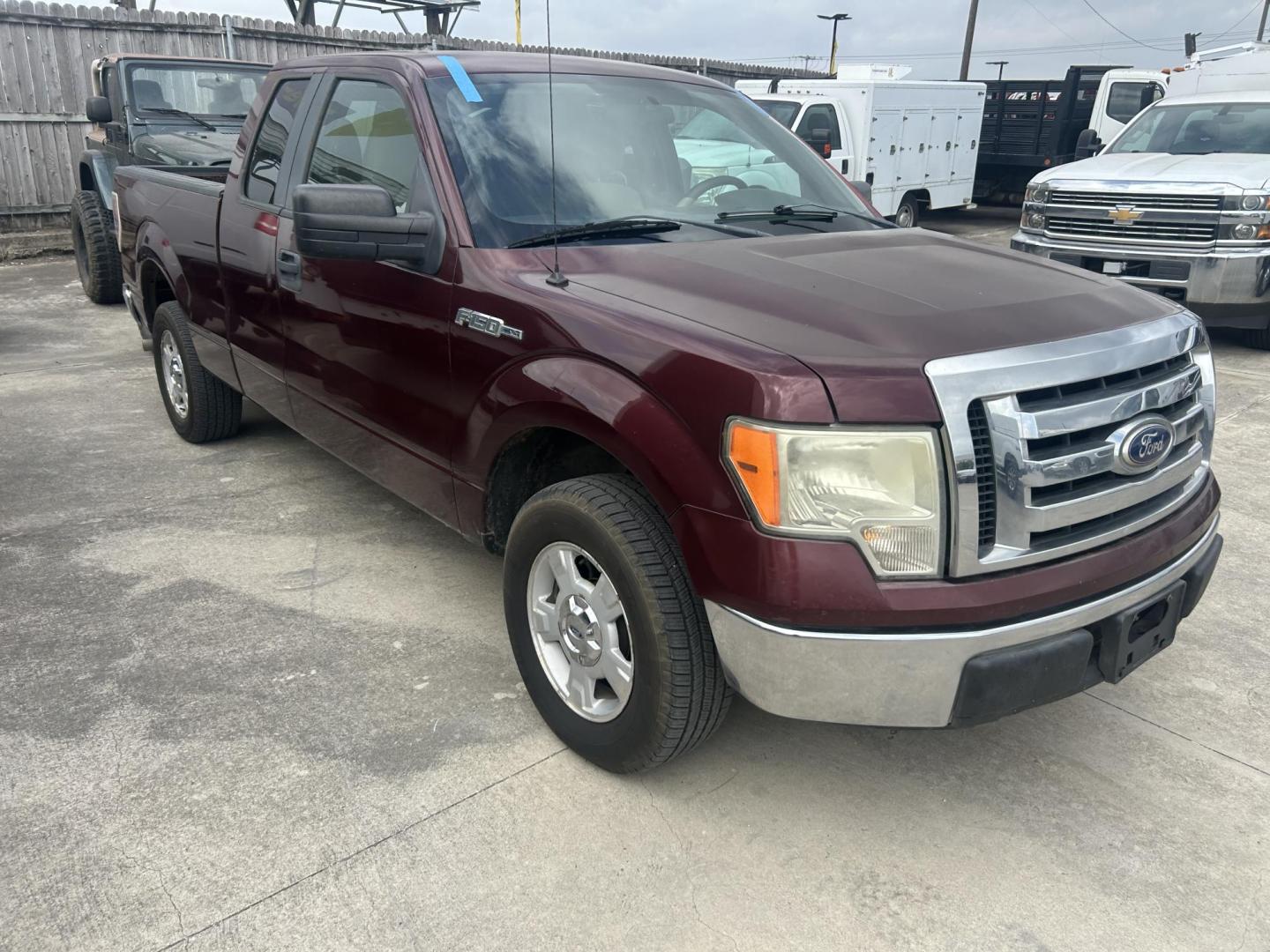 2010 Maroon Ford F-150 Lariat SuperCab 6.5-ft. Bed 2WD (1FTEX1C89AK) with an 4.6L V8 SOHC 24V engine, 4-Speed Automatic transmission, located at 1687 Business 35 S, New Braunfels, TX, 78130, (830) 625-7159, 29.655487, -98.051491 - Photo#2