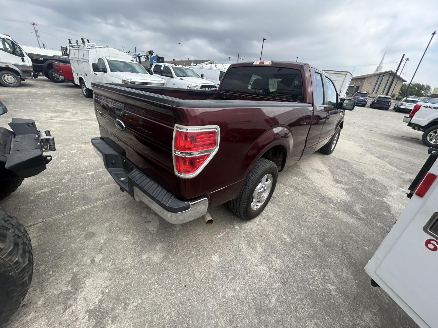 2010 Maroon Ford F-150 Lariat SuperCab 6.5-ft. Bed 2WD (1FTEX1C89AK) with an 4.6L V8 SOHC 24V engine, 4-Speed Automatic transmission, located at 1687 Business 35 S, New Braunfels, TX, 78130, (830) 625-7159, 29.655487, -98.051491 - Photo#1