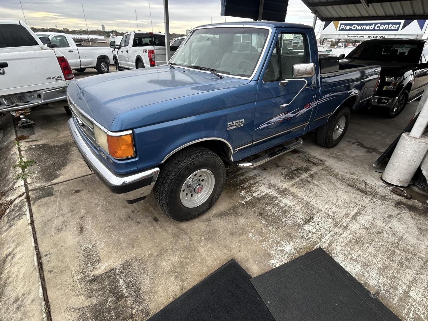1991 Blue Ford F-150 Reg. Cab Long Bed 4WD (2FTEF14N1MC) with an 5.0L V8 OHV 16V engine, 4-Speed Automatic Overdrive transmission, located at 1687 Business 35 S, New Braunfels, TX, 78130, (830) 625-7159, 29.655487, -98.051491 - Photo#0