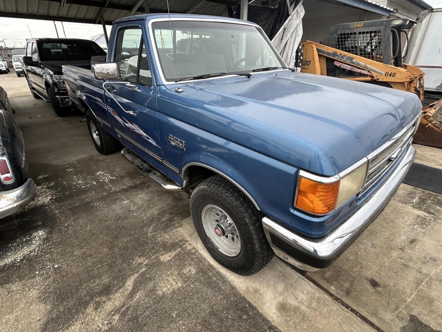 1991 Blue Ford F-150 Reg. Cab Long Bed 4WD (2FTEF14N1MC) with an 5.0L V8 OHV 16V engine, 4-Speed Automatic Overdrive transmission, located at 1687 Business 35 S, New Braunfels, TX, 78130, (830) 625-7159, 29.655487, -98.051491 - Photo#1