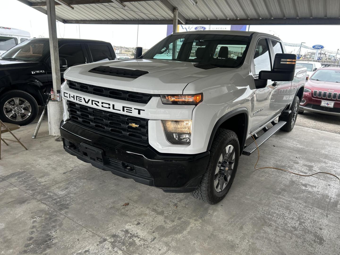 2023 White Chevrolet Silverado 2500HD Custom Crew Cab Short Box 4WD (1GC4YME79PF) with an 6.6L V8 OHV 16V engine, 6A transmission, located at 1687 Business 35 S, New Braunfels, TX, 78130, (830) 625-7159, 29.655487, -98.051491 - Photo#0