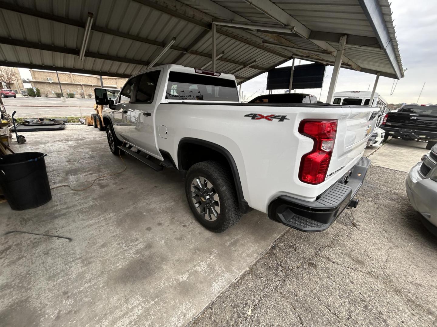 2023 White Chevrolet Silverado 2500HD Custom Crew Cab Short Box 4WD (1GC4YME79PF) with an 6.6L V8 OHV 16V engine, 6A transmission, located at 1687 Business 35 S, New Braunfels, TX, 78130, (830) 625-7159, 29.655487, -98.051491 - Photo#4