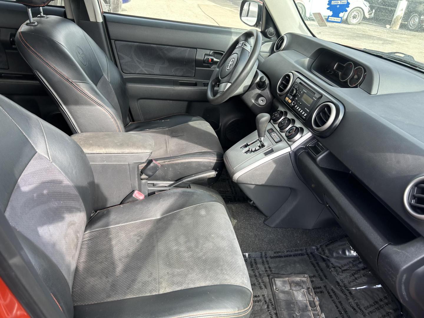 2012 Orange Scion xB 5-Door Wagon 5-Spd MT (JTLZE4FE5CJ) with an 2.4L L4 DOHC 16V engine, 5-Speed Manual transmission, located at 1687 Business 35 S, New Braunfels, TX, 78130, (830) 625-7159, 29.655487, -98.051491 - Photo#2