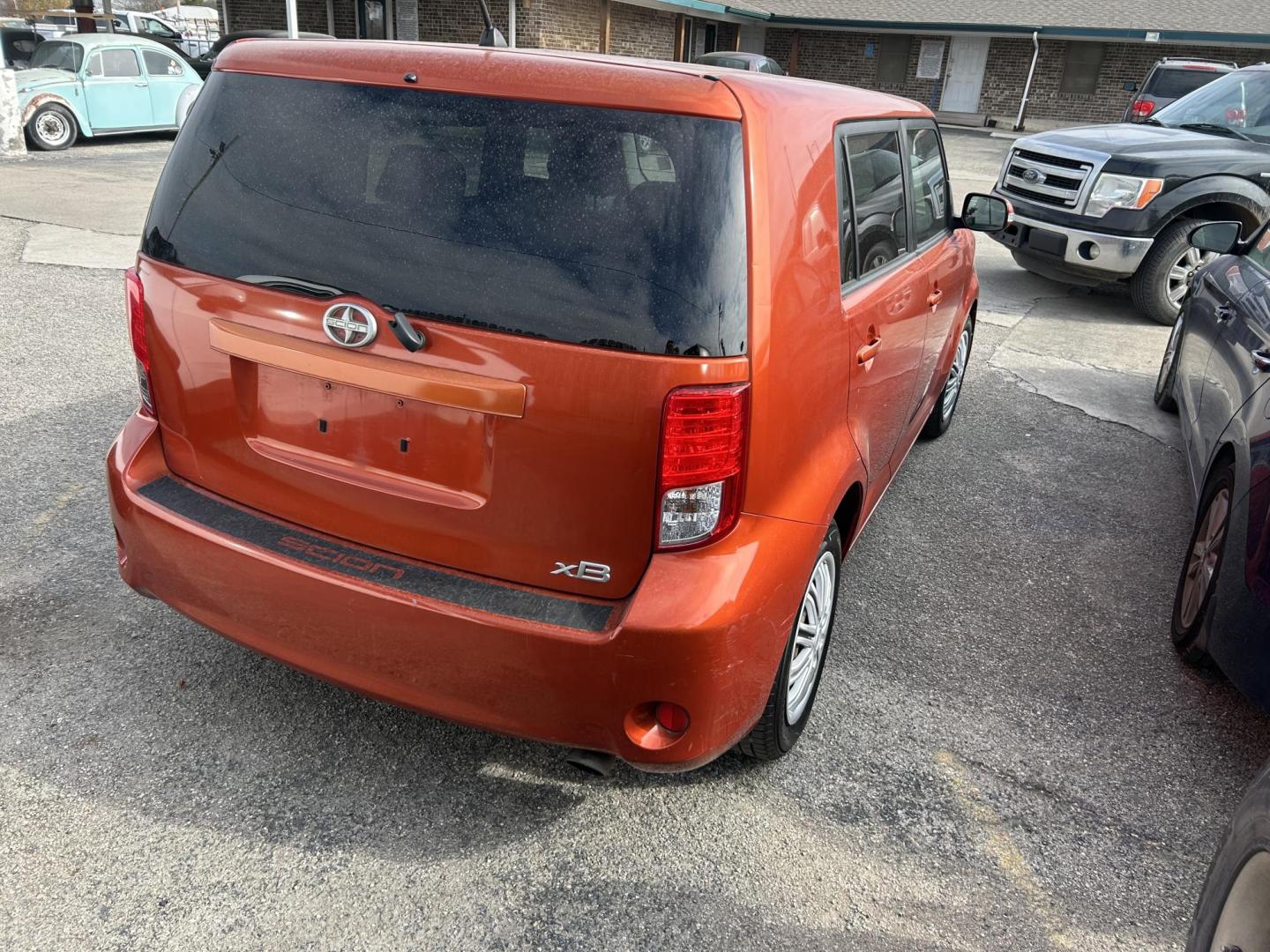 2012 Orange Scion xB 5-Door Wagon 5-Spd MT (JTLZE4FE5CJ) with an 2.4L L4 DOHC 16V engine, 5-Speed Manual transmission, located at 1687 Business 35 S, New Braunfels, TX, 78130, (830) 625-7159, 29.655487, -98.051491 - Photo#6