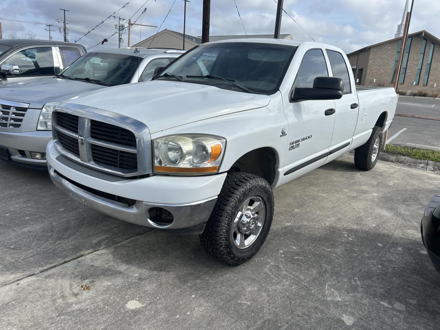 2006 White Dodge Ram 3500 Laramie Quad Cab 4WD (3D7LX38C66G) with an 5.9L L6 OHV 24V TURBO DIESEL engine, located at 1687 Business 35 S, New Braunfels, TX, 78130, (830) 625-7159, 29.655487, -98.051491 - Photo#0