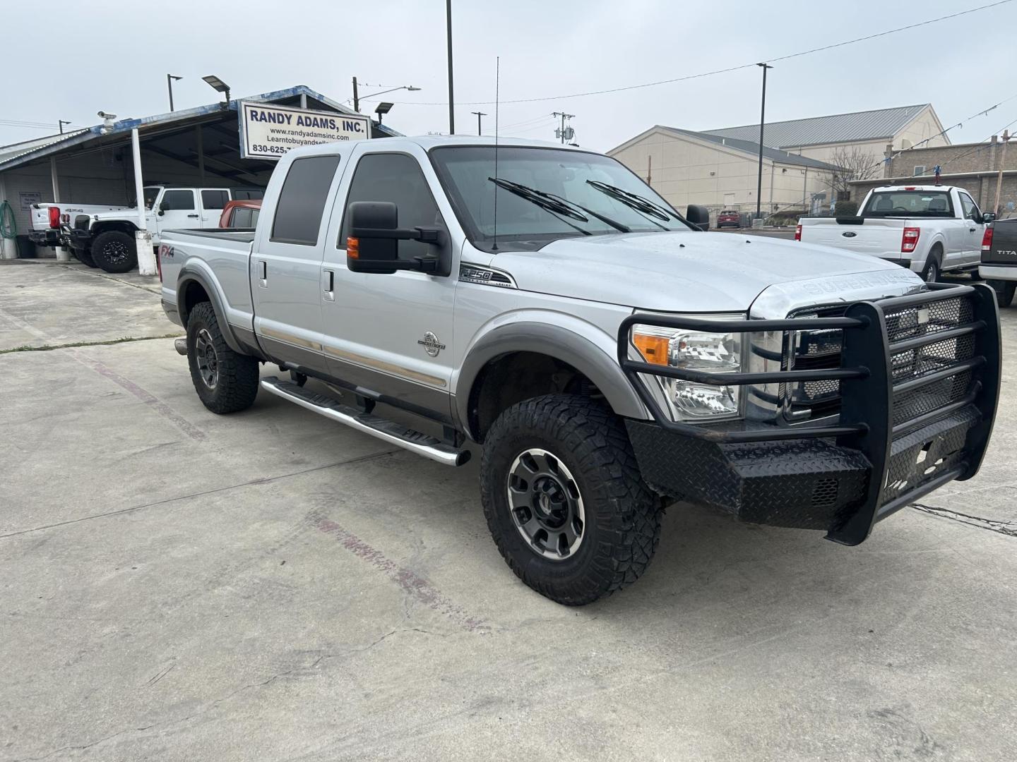 2014 Silver Ford F-250 SD LariatCrew Cab 4WD (1FT7W2BT5EE) with an 6.7L V8 OHV 16V DIESEL engine, 6-Speed Automatic transmission, located at 1687 Business 35 S, New Braunfels, TX, 78130, (830) 625-7159, 29.655487, -98.051491 - Photo#1