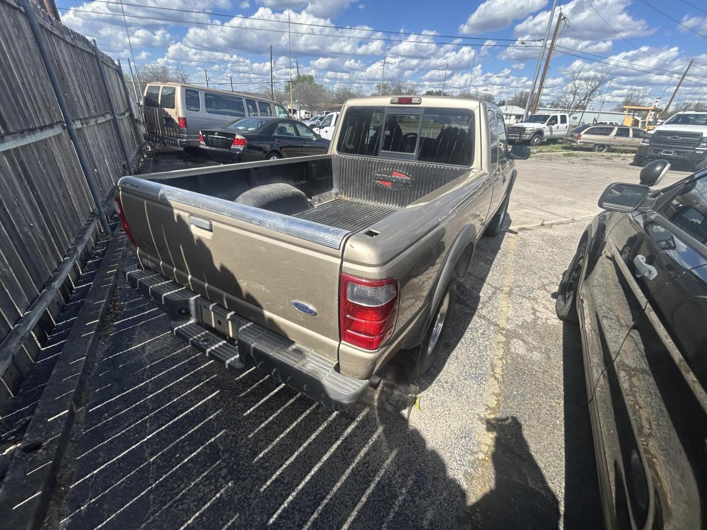 2001 Tan Ford Ranger Edge Plus SuperCab 4.0 4WD (1FTZR15E81P) with an 4.0L V6 SOHC 12V engine, 5-Speed Manual Overdrive transmission, located at 1687 Business 35 S, New Braunfels, TX, 78130, (830) 625-7159, 29.655487, -98.051491 - Photo#4