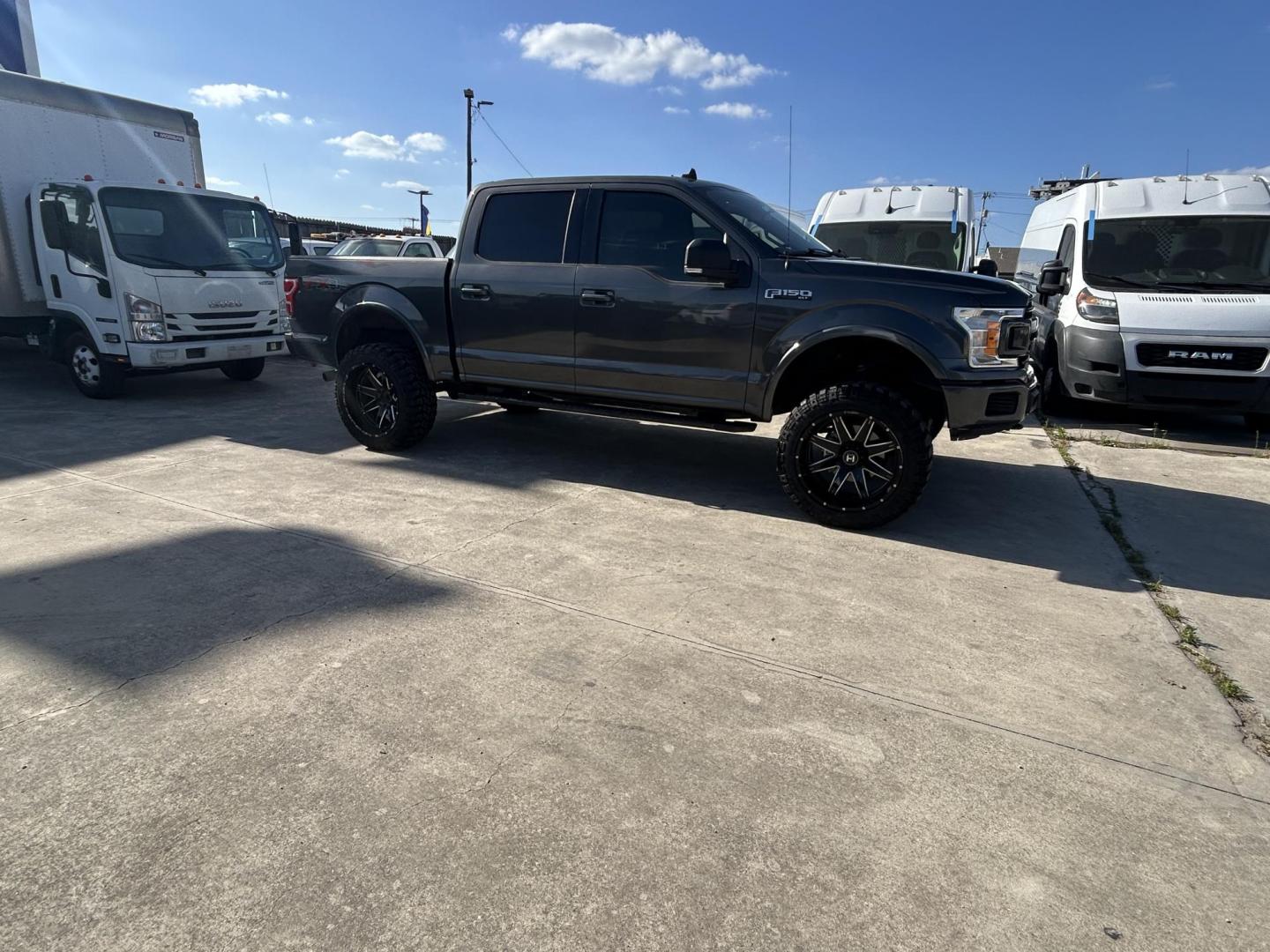 2019 Gray Ford F-150 Lariat SuperCrew 5.5-ft. Bed 4WD (1FTEW1E55KK) with an 5.0L V8 OHV 32V engine, 6A transmission, located at 1687 Business 35 S, New Braunfels, TX, 78130, (830) 625-7159, 29.655487, -98.051491 - Photo#1