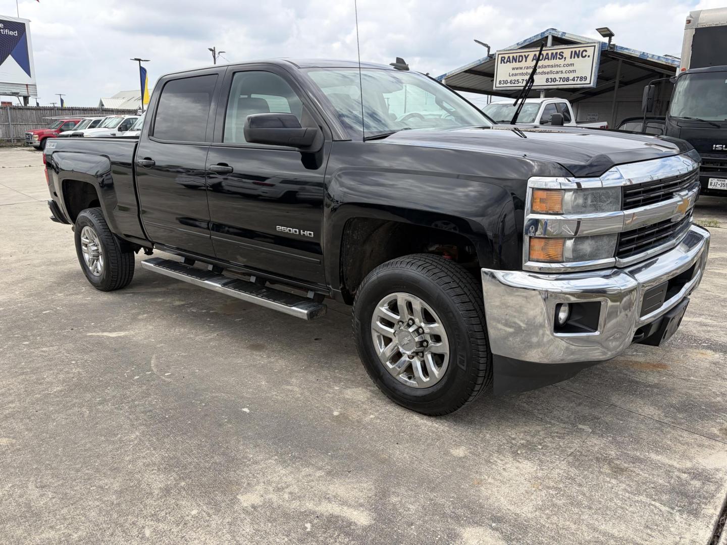 2015 Black Chevrolet Silverado 2500HD LT Crew Cab 6.5ft 4WD (1GC1KVEG5FF) with an 6.0L V8 OHV 16V FFV engine, 6-Speed Automatic transmission, located at 1687 Business 35 S, New Braunfels, TX, 78130, (830) 625-7159, 29.655487, -98.051491 - Photo#1