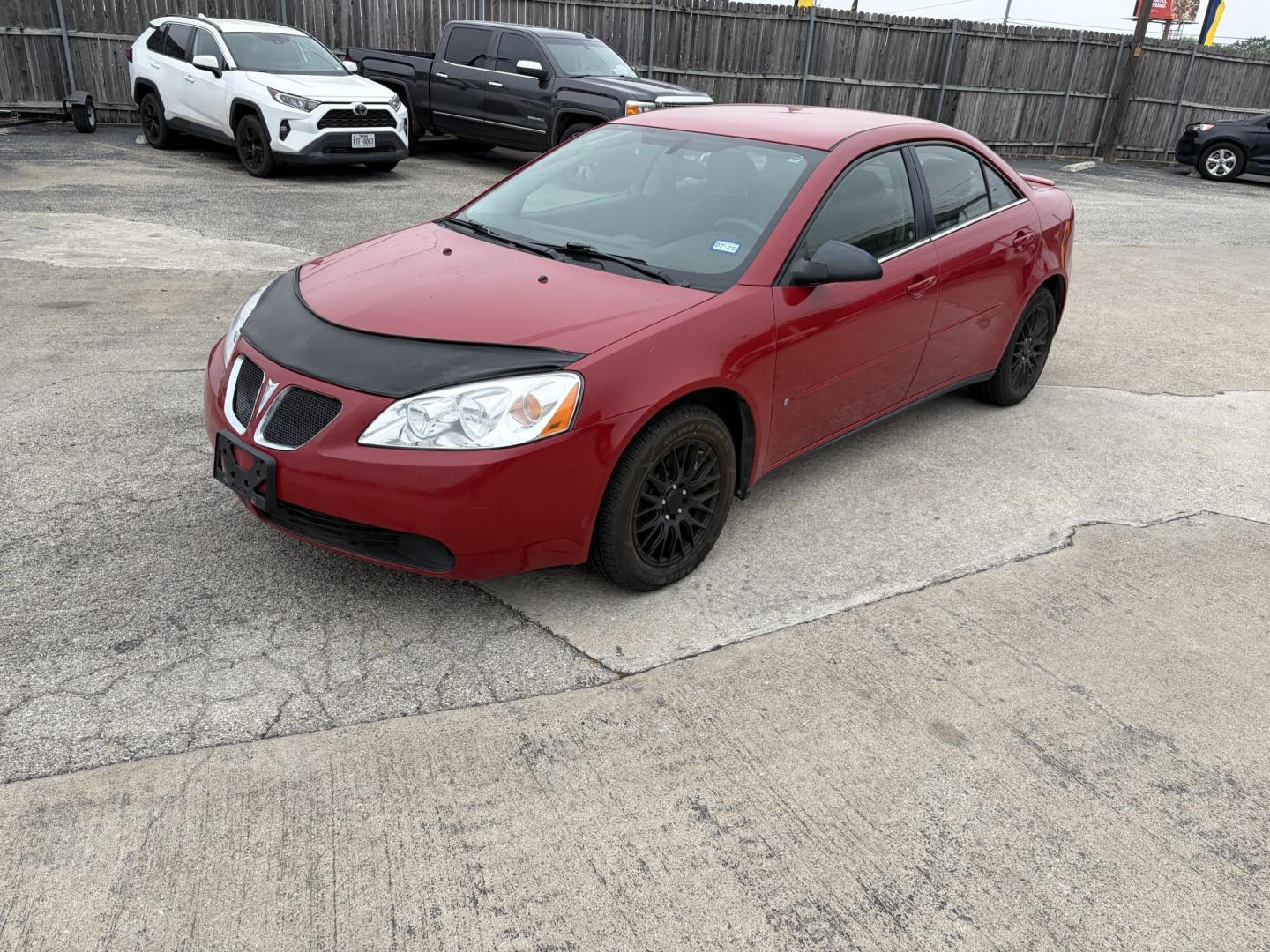 2006 Red Pontiac G6 V6 Sedan (1G2ZG558164) with an 3.5L V6 OHV 12V engine, 4-Speed Automatic Overdrive transmission, located at 1687 Business 35 S, New Braunfels, TX, 78130, (830) 625-7159, 29.655487, -98.051491 - Photo#0