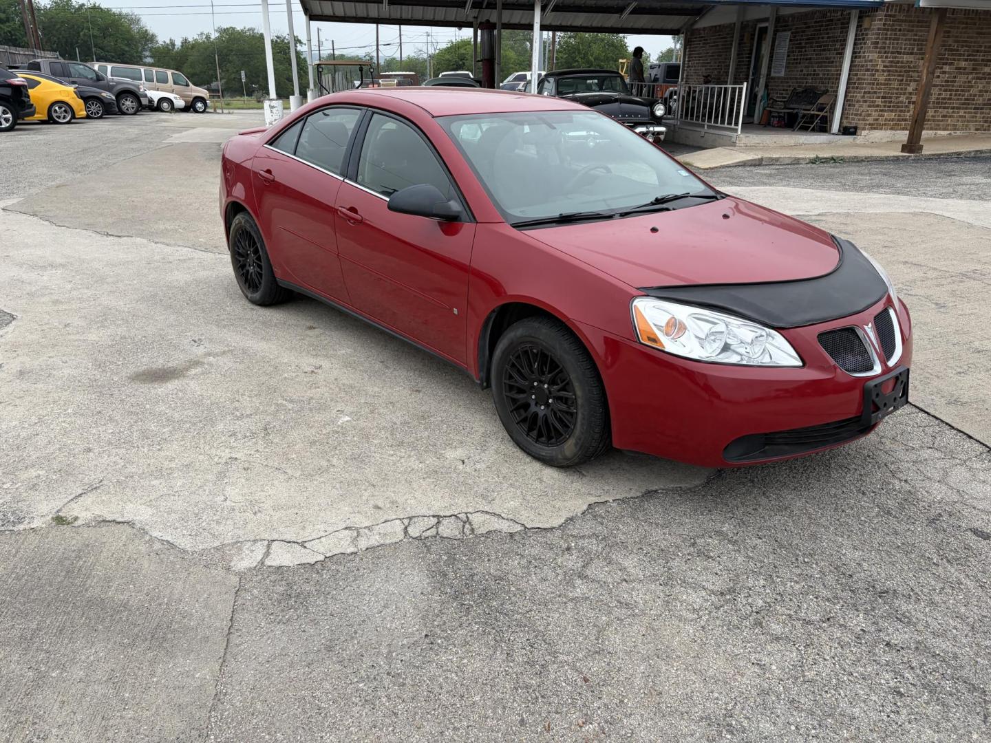 2006 Red Pontiac G6 V6 Sedan (1G2ZG558164) with an 3.5L V6 OHV 12V engine, 4-Speed Automatic Overdrive transmission, located at 1687 Business 35 S, New Braunfels, TX, 78130, (830) 625-7159, 29.655487, -98.051491 - Photo#4