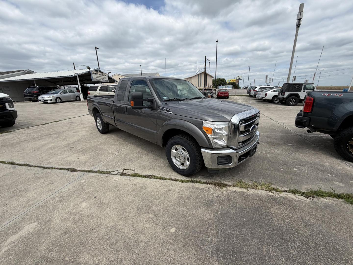 2012 Gray Ford F-250 SD Lariat SuperCab 2WD (1FT7X2A6XCE) with an 6.2L V8 OHV 16V engine, 6-Speed Automatic transmission, located at 1687 Business 35 S, New Braunfels, TX, 78130, (830) 625-7159, 29.655487, -98.051491 - Photo#1