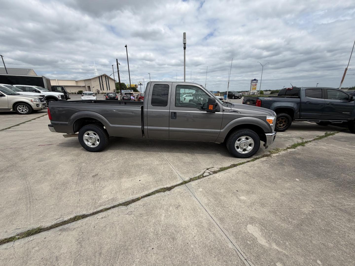 2012 Gray Ford F-250 SD Lariat SuperCab 2WD (1FT7X2A6XCE) with an 6.2L V8 OHV 16V engine, 6-Speed Automatic transmission, located at 1687 Business 35 S, New Braunfels, TX, 78130, (830) 625-7159, 29.655487, -98.051491 - Photo#2