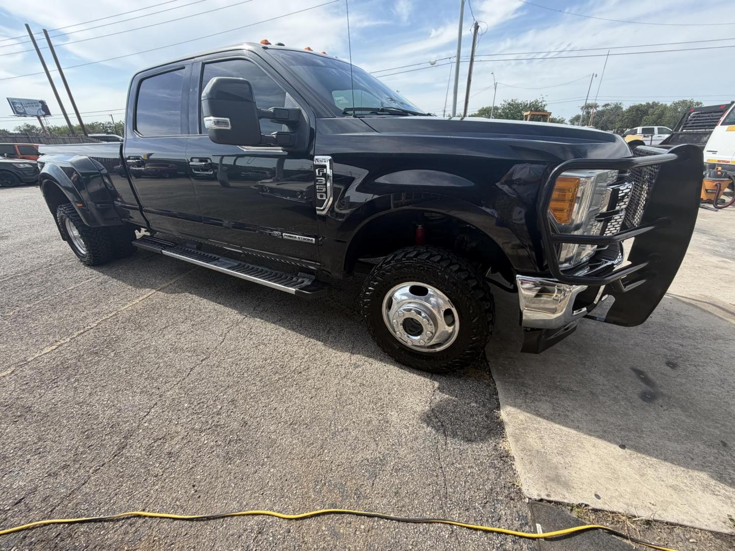 2017 Black Ford F-350 SD Lariat Crew Cab Long Bed DRW 4WD (1FT8W3DT5HE) with an 6.7L V8 OHV 16V DIESEL engine, 6A transmission, located at 1687 Business 35 S, New Braunfels, TX, 78130, (830) 625-7159, 29.655487, -98.051491 - Photo#1