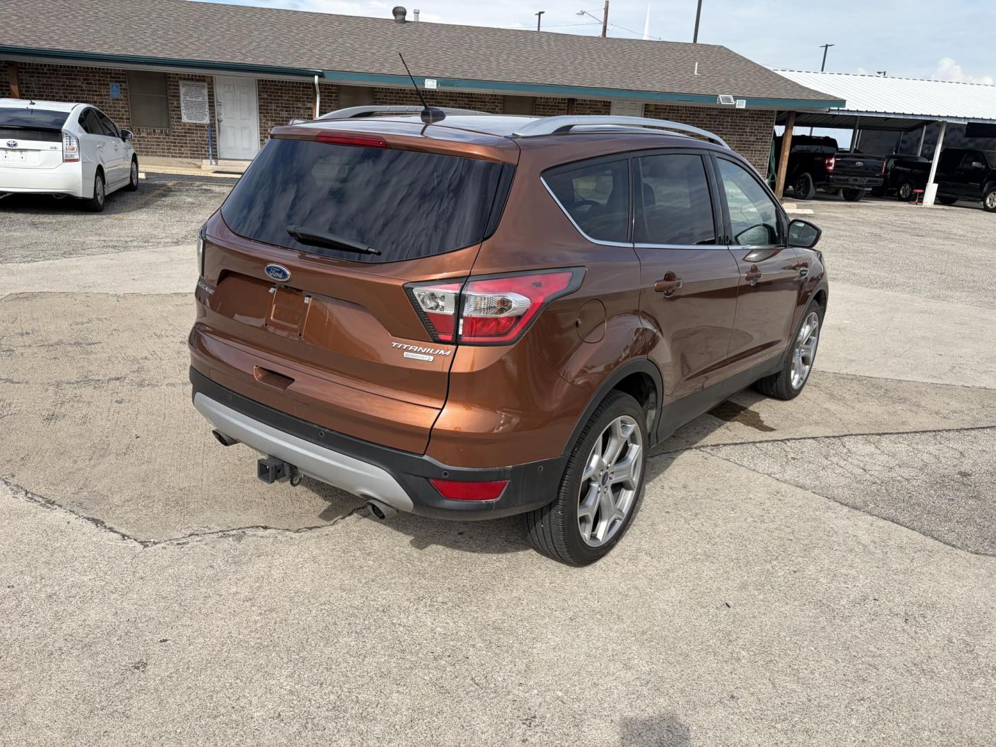 2017 Copper Ford Escape Titanium FWD (1FMCU0J9XHU) with an 2.0L L4 DOHC 16V engine, 6A transmission, located at 1687 Business 35 S, New Braunfels, TX, 78130, (830) 625-7159, 29.655487, -98.051491 - Photo#5