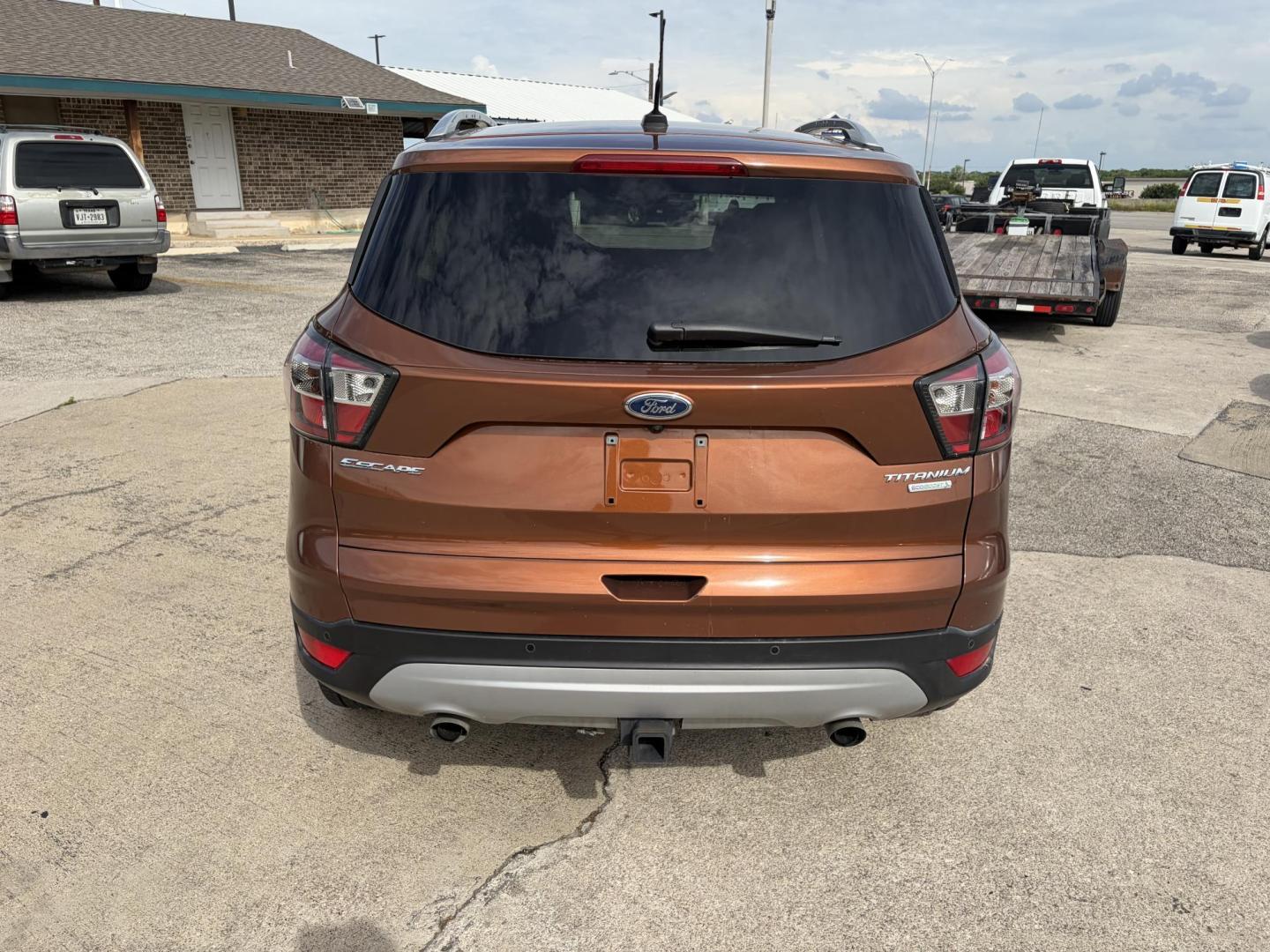 2017 Copper Ford Escape Titanium FWD (1FMCU0J9XHU) with an 2.0L L4 DOHC 16V engine, 6A transmission, located at 1687 Business 35 S, New Braunfels, TX, 78130, (830) 625-7159, 29.655487, -98.051491 - Photo#6