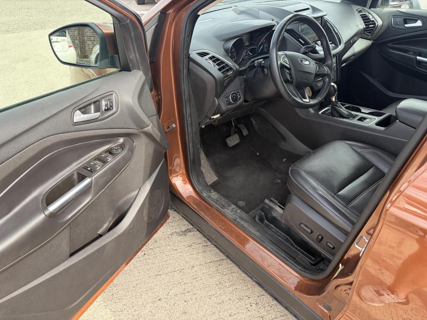2017 Copper Ford Escape Titanium FWD (1FMCU0J9XHU) with an 2.0L L4 DOHC 16V engine, 6A transmission, located at 1687 Business 35 S, New Braunfels, TX, 78130, (830) 625-7159, 29.655487, -98.051491 - Photo#9