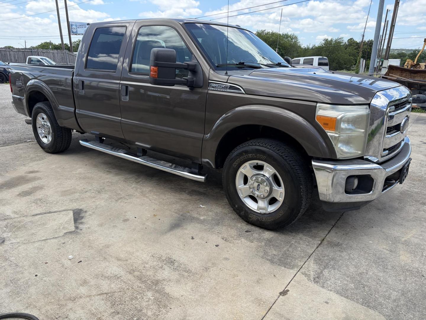 2015 Brown Ford F-250 SD XLT Crew Cab 2WD (1FT7W2A61FE) with an 6.2L V8 OHV 16V engine, 6-Speed Automatic transmission, located at 1687 Business 35 S, New Braunfels, TX, 78130, (830) 625-7159, 29.655487, -98.051491 - Photo#1