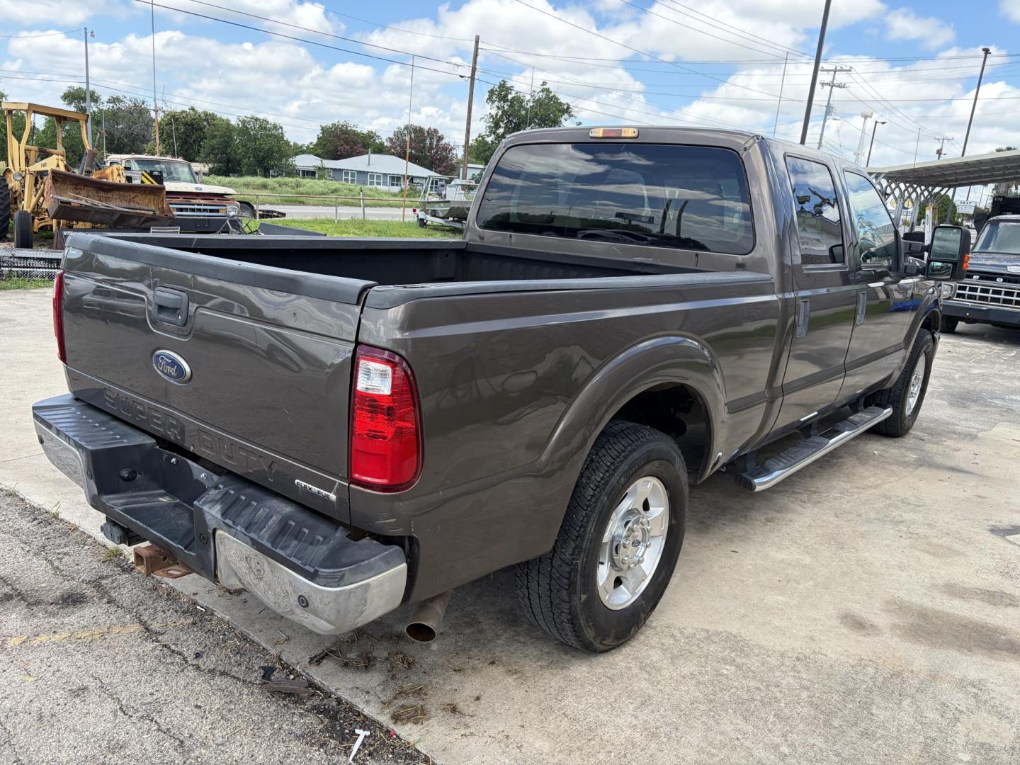 2015 Brown Ford F-250 SD XLT Crew Cab 2WD (1FT7W2A61FE) with an 6.2L V8 OHV 16V engine, 6-Speed Automatic transmission, located at 1687 Business 35 S, New Braunfels, TX, 78130, (830) 625-7159, 29.655487, -98.051491 - Photo#6