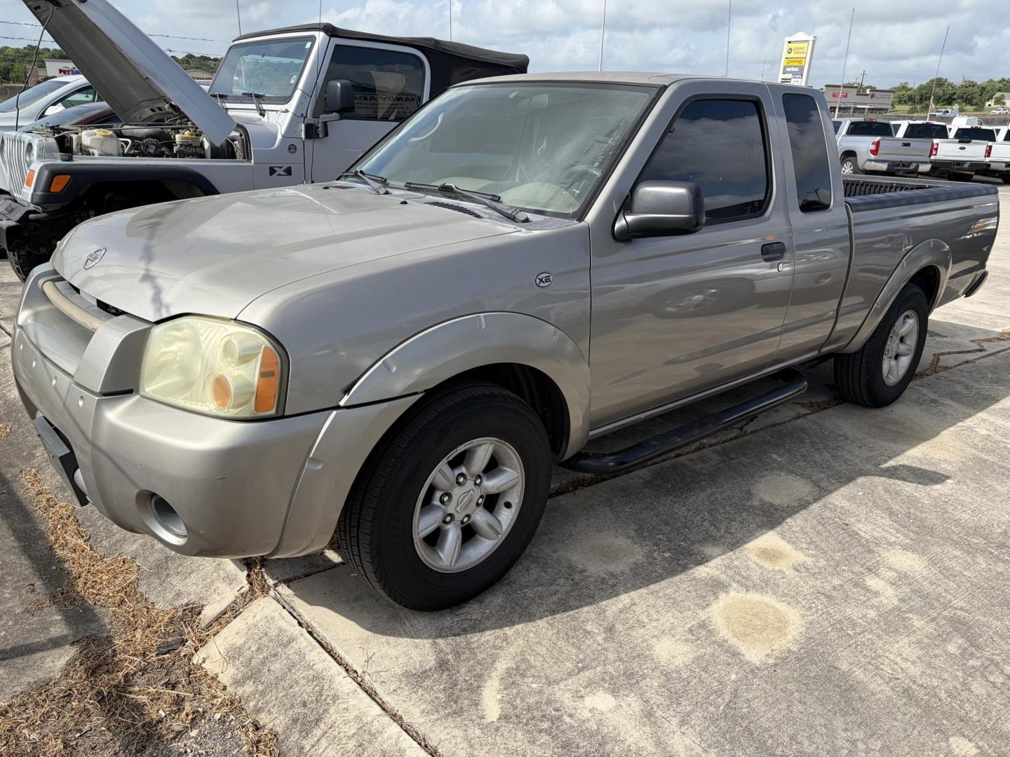 2004 Tan Nissan Frontier King Cab 2WD (1N6DD26T24C) with an 2.4L L4 DOHC 16V engine, 5-Speed Manual Overdrive transmission, located at 1687 Business 35 S, New Braunfels, TX, 78130, (830) 625-7159, 29.655487, -98.051491- Photo#0