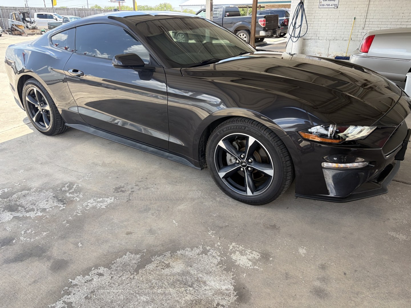 2022 Black Ford Mustang EcoBoost Coupe (1FA6P8TH0N5) with an 2.3L L4 DOHC 16V engine, located at 1687 Business 35 S, New Braunfels, TX, 78130, (830) 625-7159, 29.655487, -98.051491- Photo#1