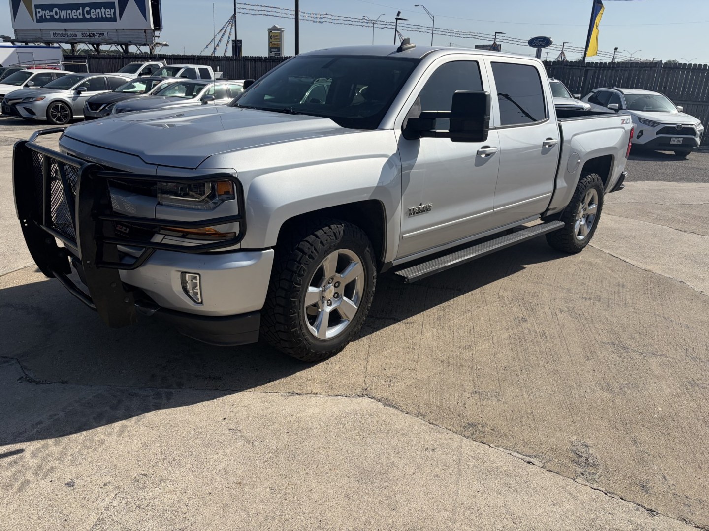 2018 Silver Chevrolet Silverado 1500 LT Crew Cab Long Box 4WD (3GCUKREC2JG) with an 5.3L V8 OHV 16V engine, 6A transmission, located at 1687 Business 35 S, New Braunfels, TX, 78130, (830) 625-7159, 29.655487, -98.051491- Photo#0