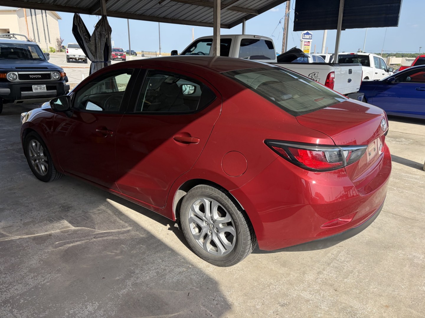 2017 Red Scion Yaris iA iA (3MYDLBYV8HY) with an 1.5L L4 DOHC 16V engine, 6A transmission, located at 1687 Business 35 S, New Braunfels, TX, 78130, (830) 625-7159, 29.655487, -98.051491- Photo#9