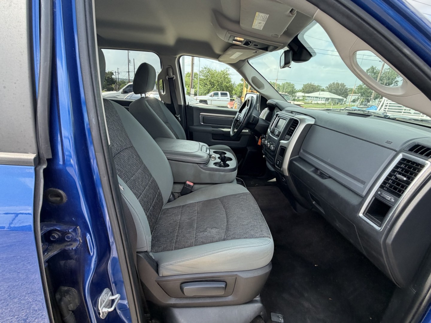 2015 Blue RAM 1500 SLT Crew Cab SWB 4WD (1C6RR7LT5FS) with an 5.7L V8 OHV 16V engine, 6-Speed Automatic transmission, located at 1687 Business 35 S, New Braunfels, TX, 78130, (830) 625-7159, 29.655487, -98.051491- Photo#2