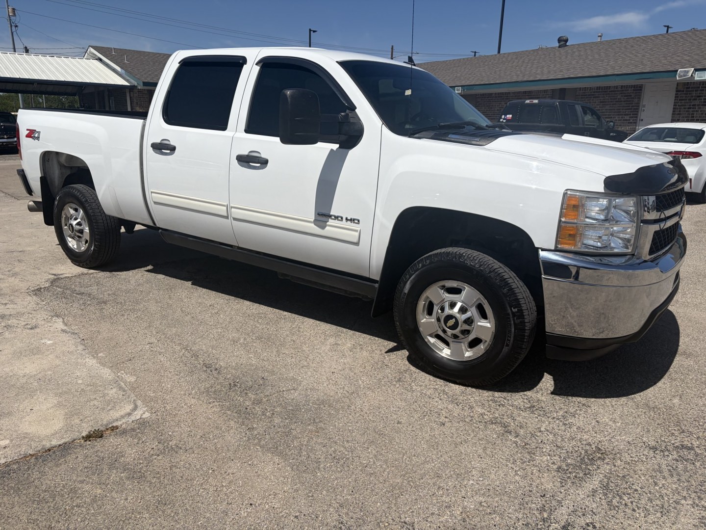 2013 White Chevrolet Silverado 2500HD LT Crew Cab 4WD (1GC1KXC84DF) with an 6.6L V8 OHV 32V TURBO DIESEL engine, 6-Speed Automatic transmission, located at 1687 Business 35 S, New Braunfels, TX, 78130, (830) 625-7159, 29.655487, -98.051491- Photo#1